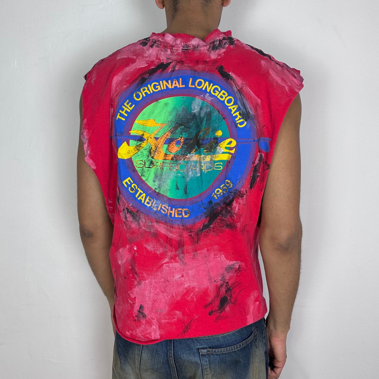 ASTROBOI* 'Hobie' red painterly graphic t-shirt, rear view showing technicolor Hobie back logo and white and black paint splatter detail, worn by male model.