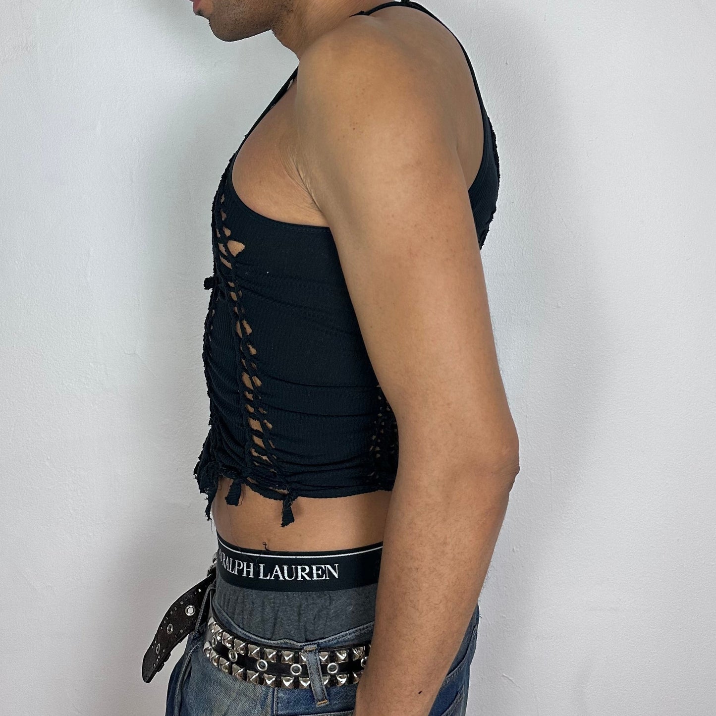  Left side detail of ASTROBOI* 'Andromeda' showing hand-braided arrangement and deconstructed cut-out detailing on cropped black tank.