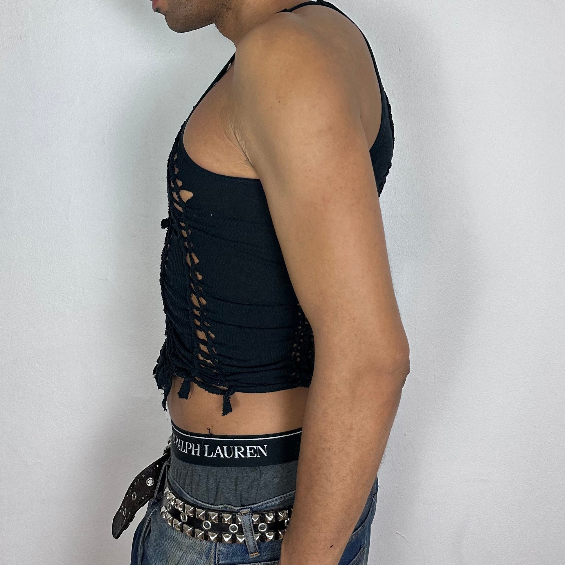  Left side detail of ASTROBOI* 'Andromeda' showing hand-braided arrangement and deconstructed cut-out detailing on cropped black tank.