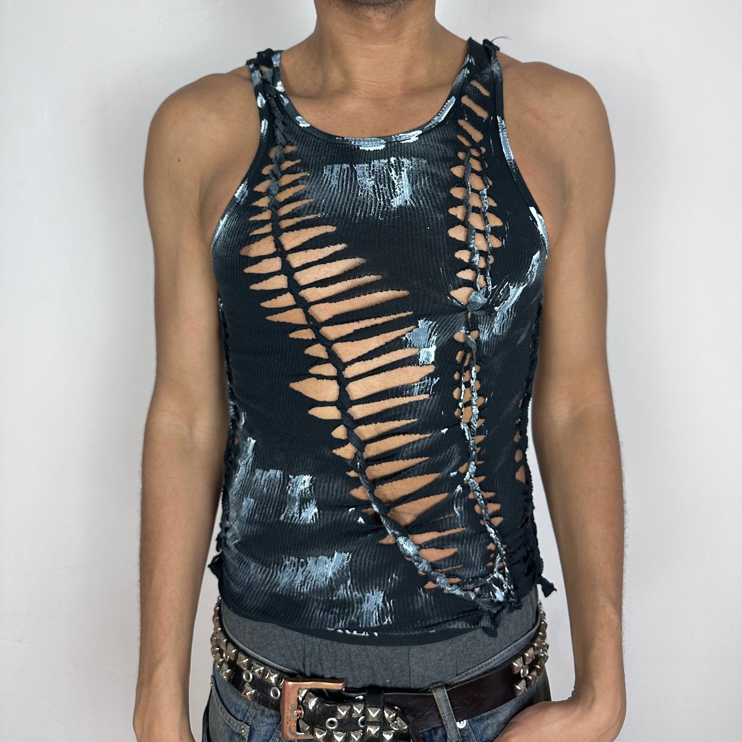 ASTROBOI* 'Oreo' black twist braided tank top with cut-outs and white abstract paint detailing throughout, close-fitting, front view.