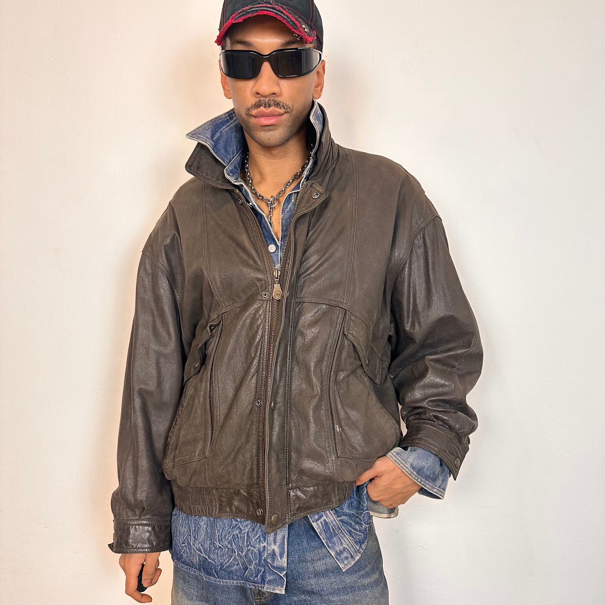 Overview of Vintage Canton Ridge brown leather bomber jacket with ribbed cuffs, elastic hem, relaxed fit, and multiple pockets, fits like XL.