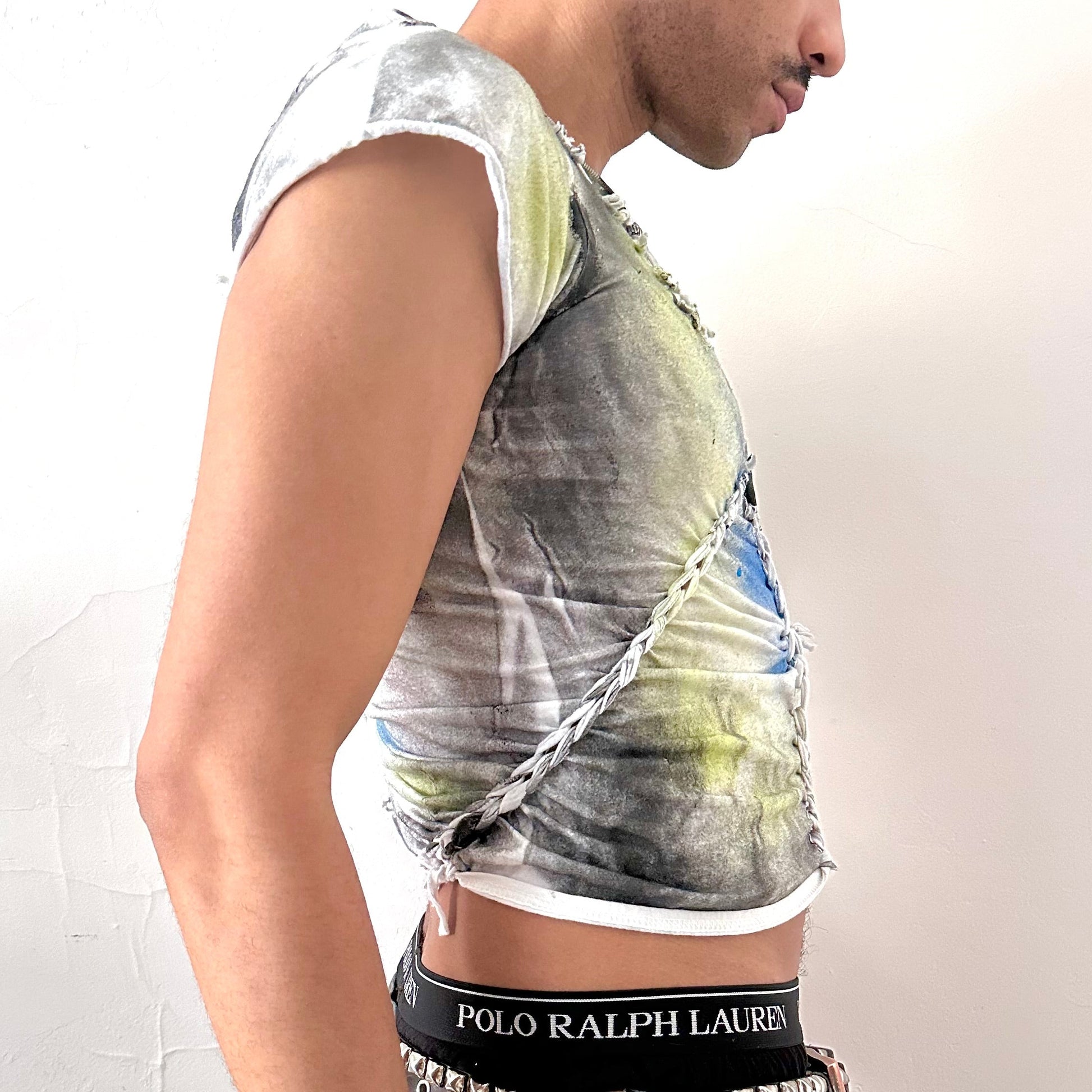 Right side detail of ASTROBOI* x Gildan 'Algae' showing braided twist detailing and abstract printed design on white heavyweight cotton base.