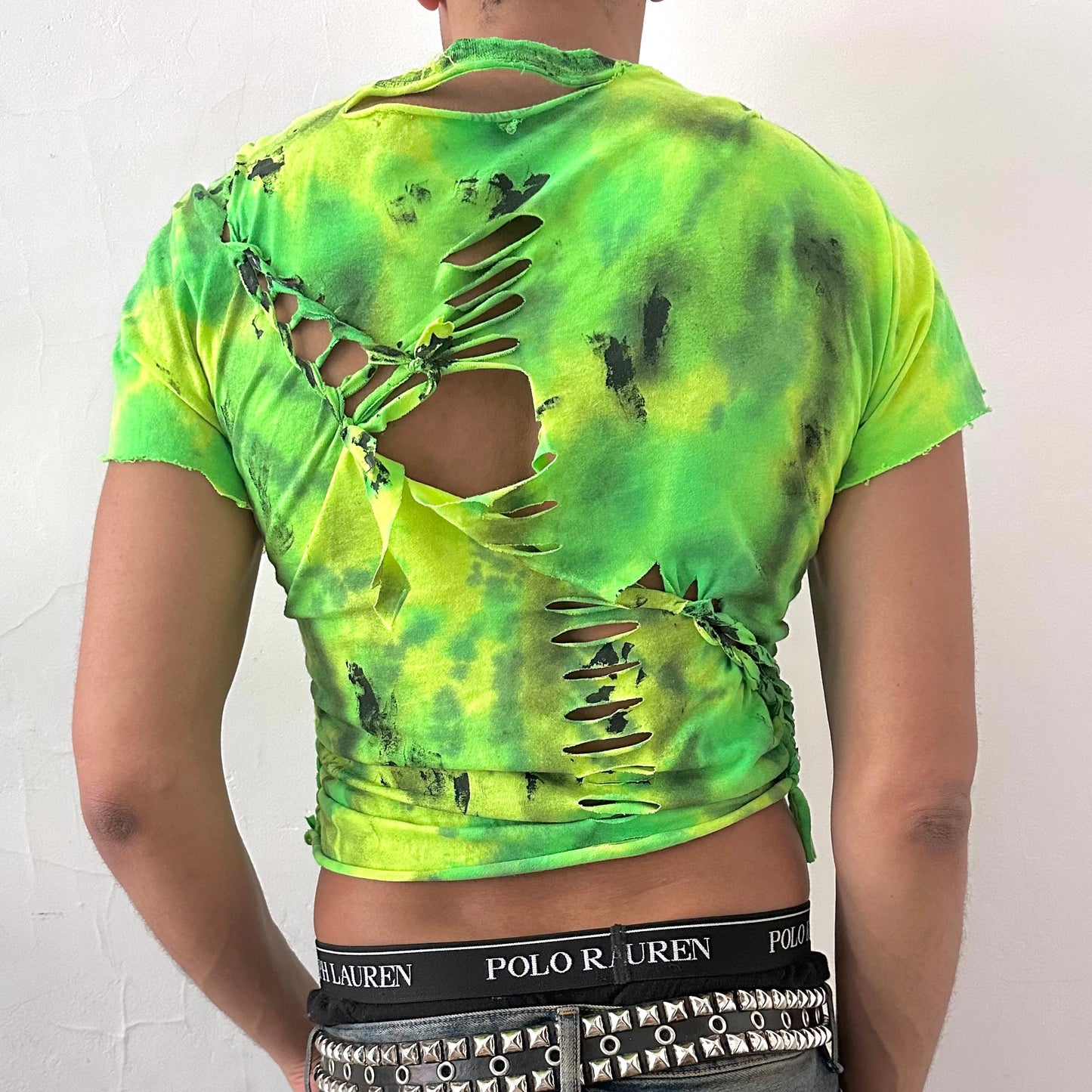 ASTROBOI* x Gildan 'Sage Pulse' green tie dye braided twist grunge t-shirt, rear view showing tie dye pattern, braid, and tar paint detail, worn by male model.