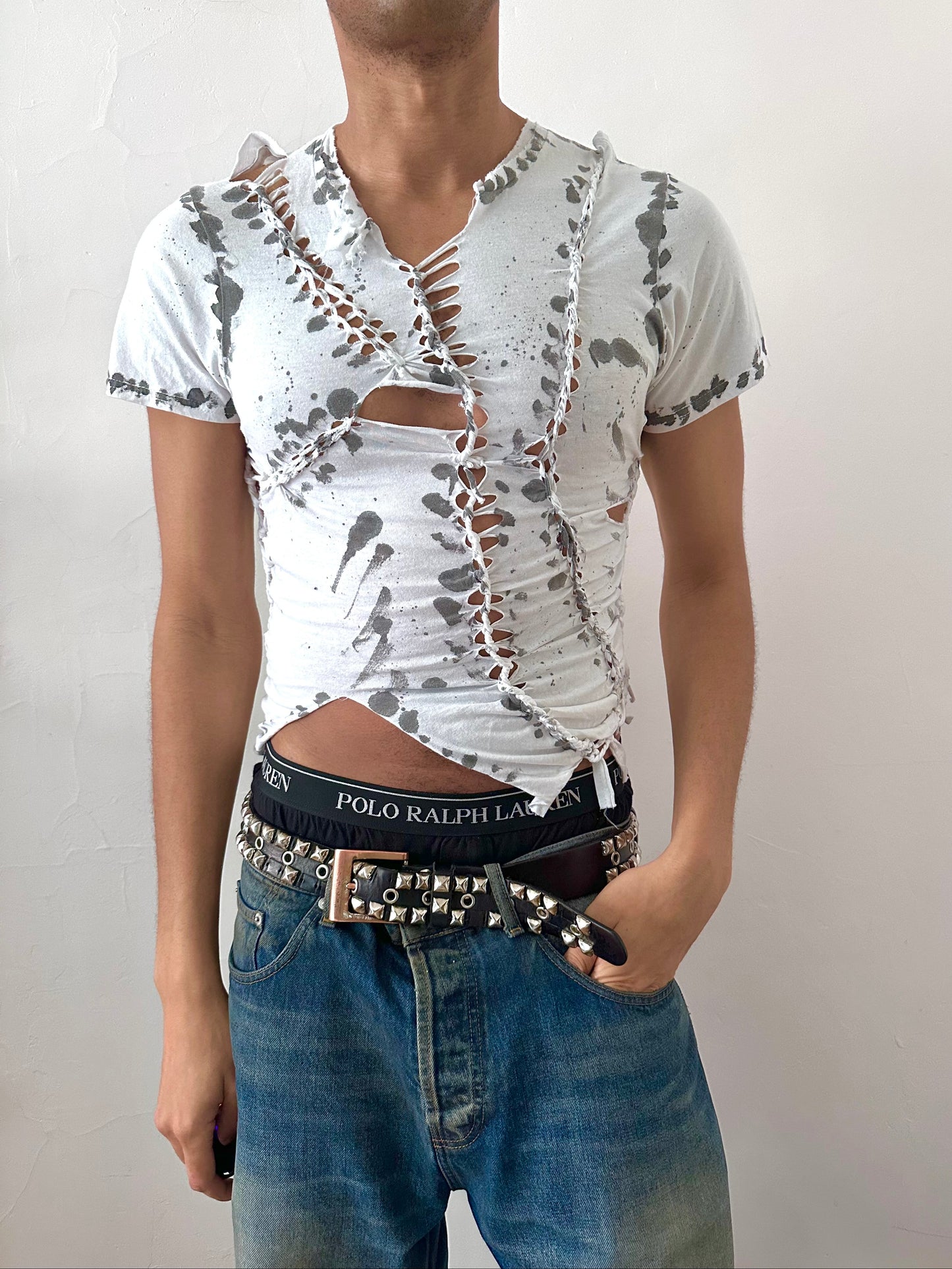Male model wearing ASTROBOI* x Gildan '1001' white braided twist t-shirt, styled full look, ASTROBOI* STUDIO NYC.