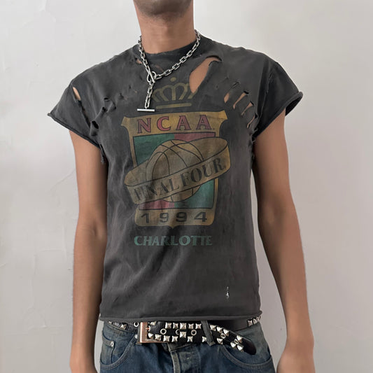 ASTROBOI* NCAA Basketball black loose-fitting ripped muscle tank top with muted chest graphic, subtle distressed holes throughout body, and raw edges, front view.