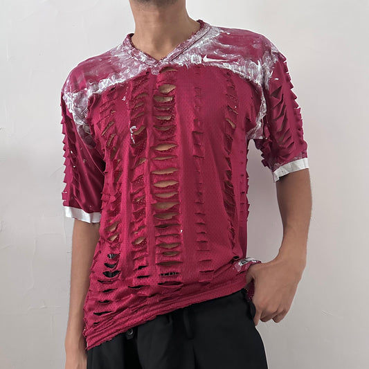 ASTROBOI* x Nike 'BloodThirst' maroon loose-fitting mesh jersey with white painterly details throughout and raw hem, front view.