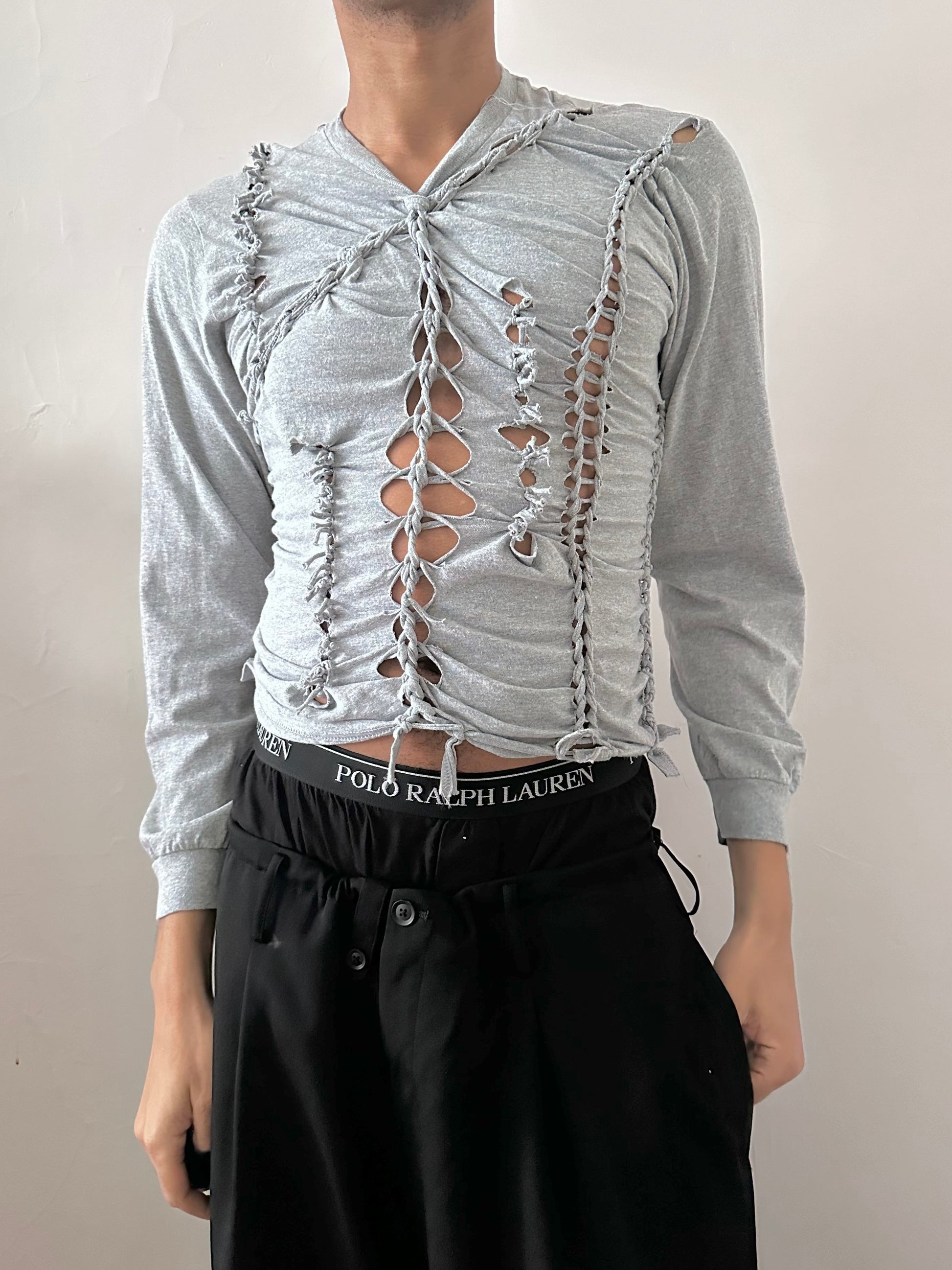 Male model wearing ASTROBOI* x Gildan 'Neutral' gray braided twist long sleeve t-shirt, styled full look, ASTROBOI* STUDIO NYC.