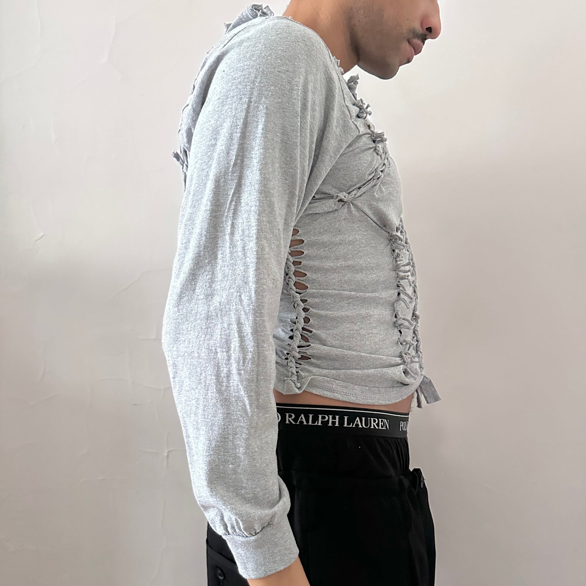 Right side detail of ASTROBOI* x Gildan 'Neutral' showing braided twist, knot, and cut-out construction on heavyweight gray cotton base.
