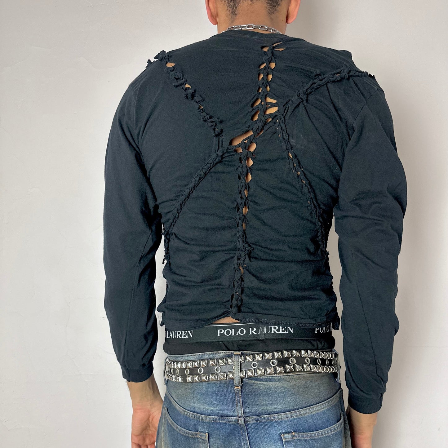 ASTROBOI* x Hanes 'Svart' black braided twist long sleeve t-shirt, rear view showing braid and knot construction, worn by male model.