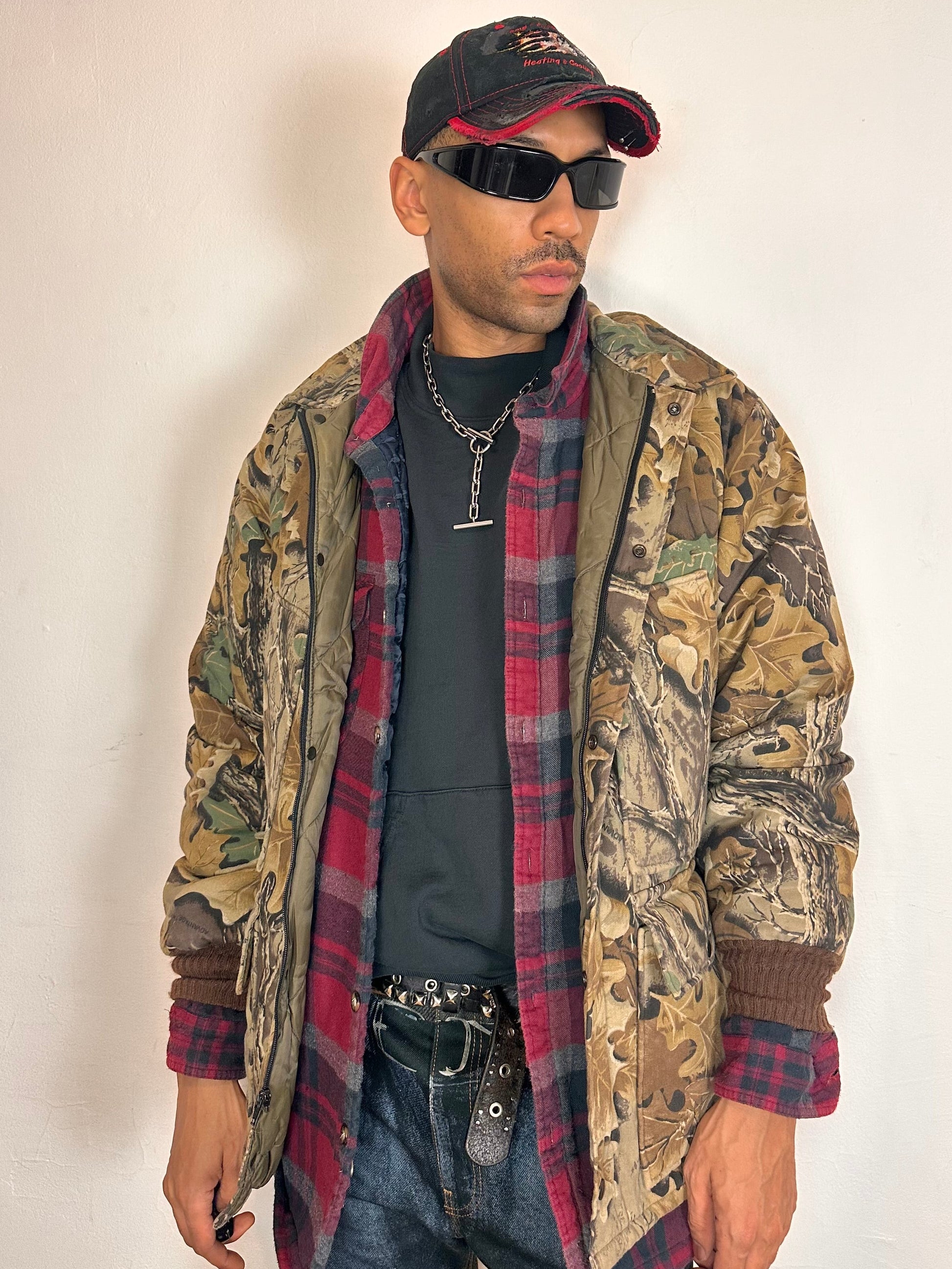 Jacket unzipped on Vintage brown RealTree camouflage quilted jacket with insulated lining, knit cuffs, four front pockets, boxy fit, size XL.