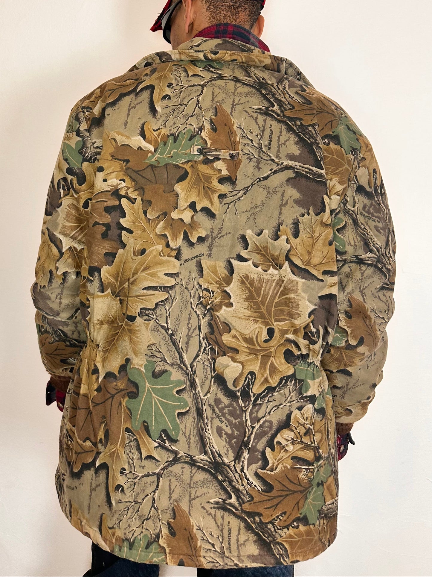 Back on Vintage brown RealTree camouflage quilted jacket with insulated lining, knit cuffs, four front pockets, boxy fit, size XL.