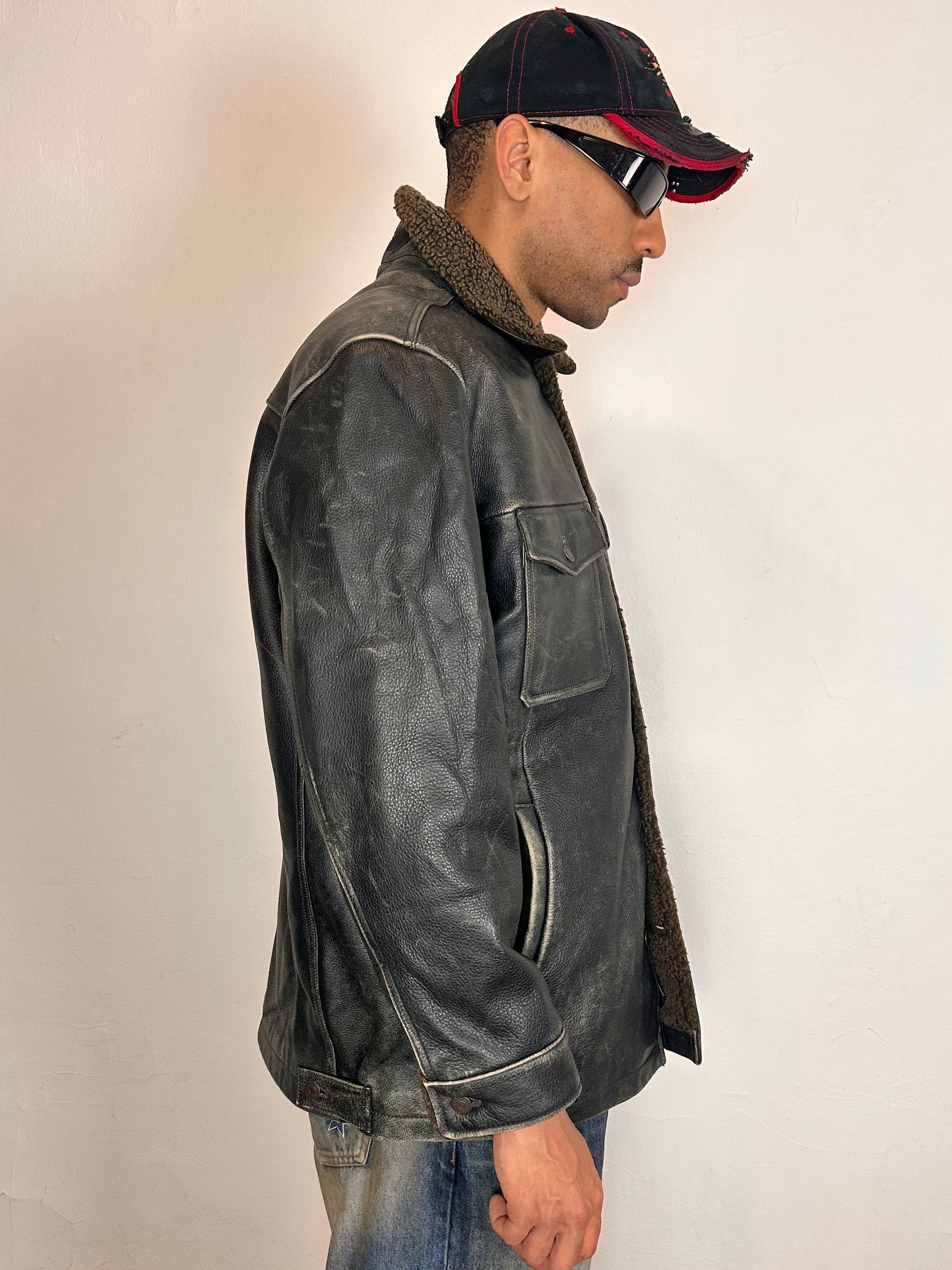 Right side of Vintage GAP blackish-brown leather shearling jacket with sherpa collar and interior, chest and hip pockets, rugged fatigued finish, size XL.