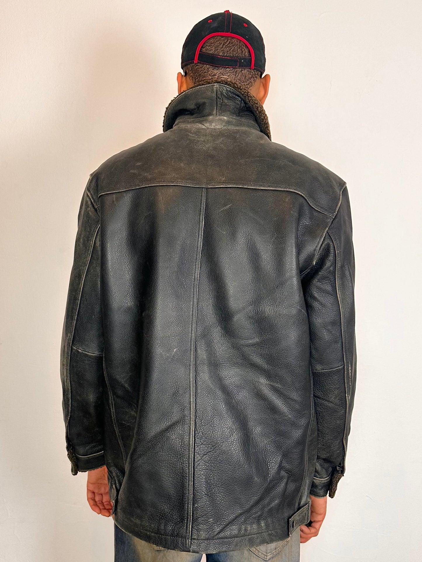 Back of Vintage GAP blackish-brown leather shearling jacket with sherpa collar and interior, chest and hip pockets, rugged fatigued finish, size XL.