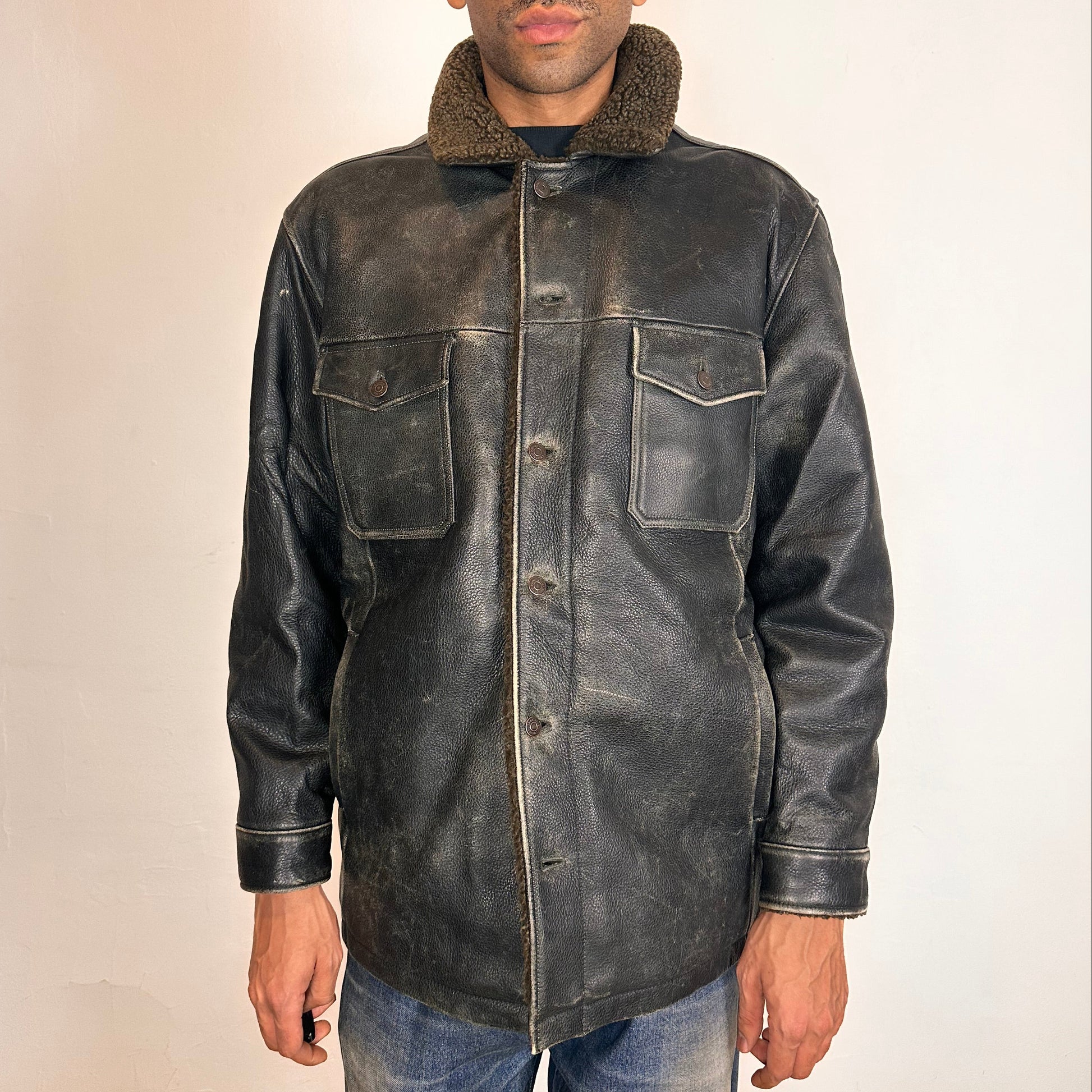 Cover of Vintage GAP blackish-brown leather shearling jacket with sherpa collar and interior, chest and hip pockets, rugged fatigued finish, size XL.