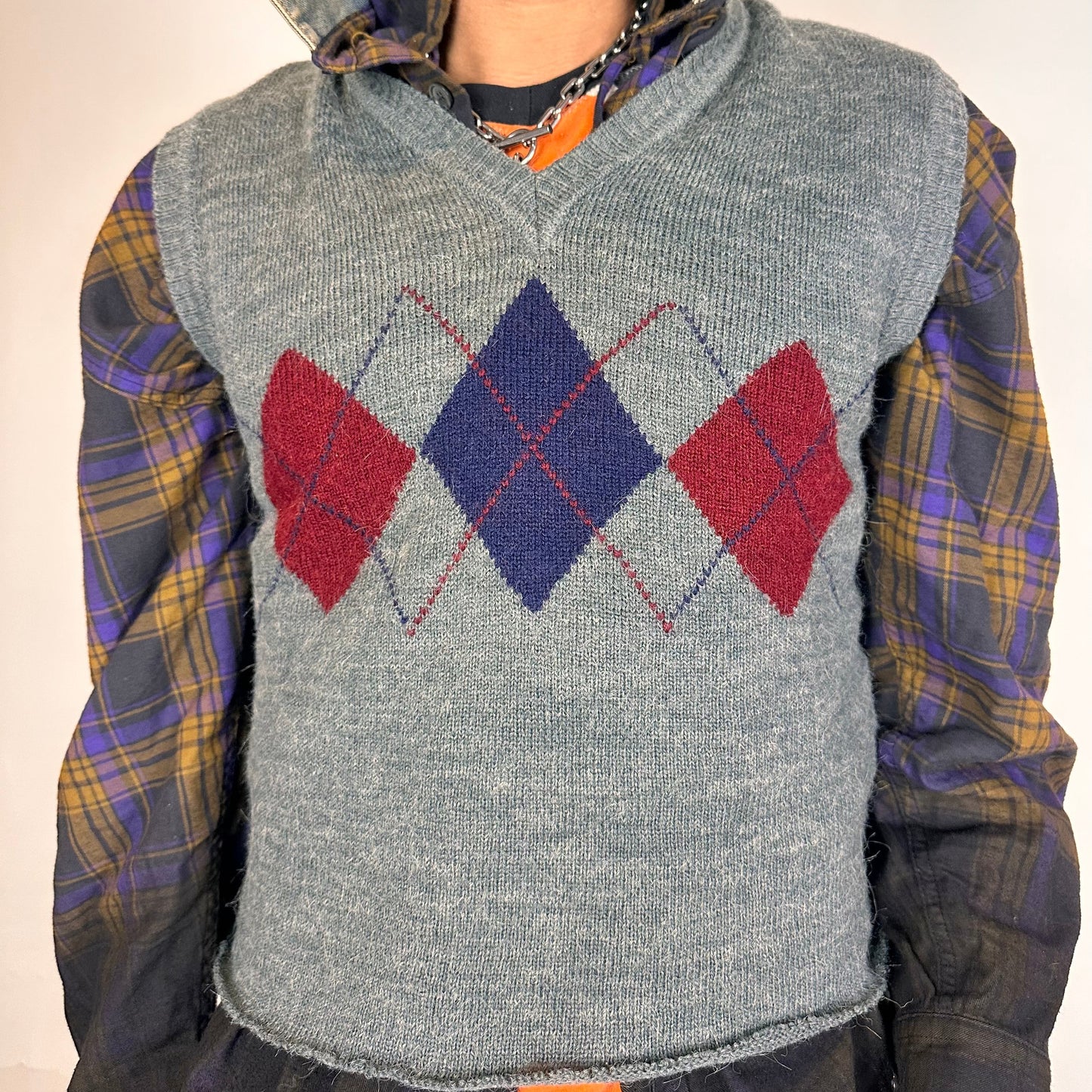 FRONT VIEW OF ASTROBOI* gray cropped argyle sweater vest in size Large with burgundy and purple pattern, raw hem, and relaxed fit. Custom made in NYC.