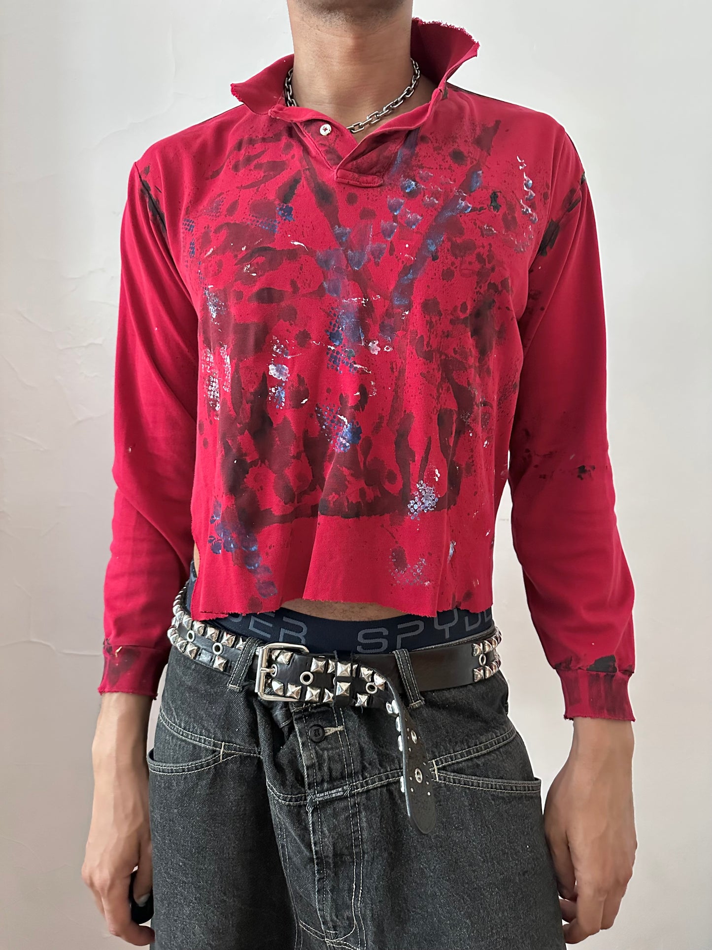Male model wearing ASTROBOI* x Polo Ralph Lauren 'Kill Switch' red grunge long sleeve festival polo, styled full look, ASTROBOI* STUDIO NYC.
