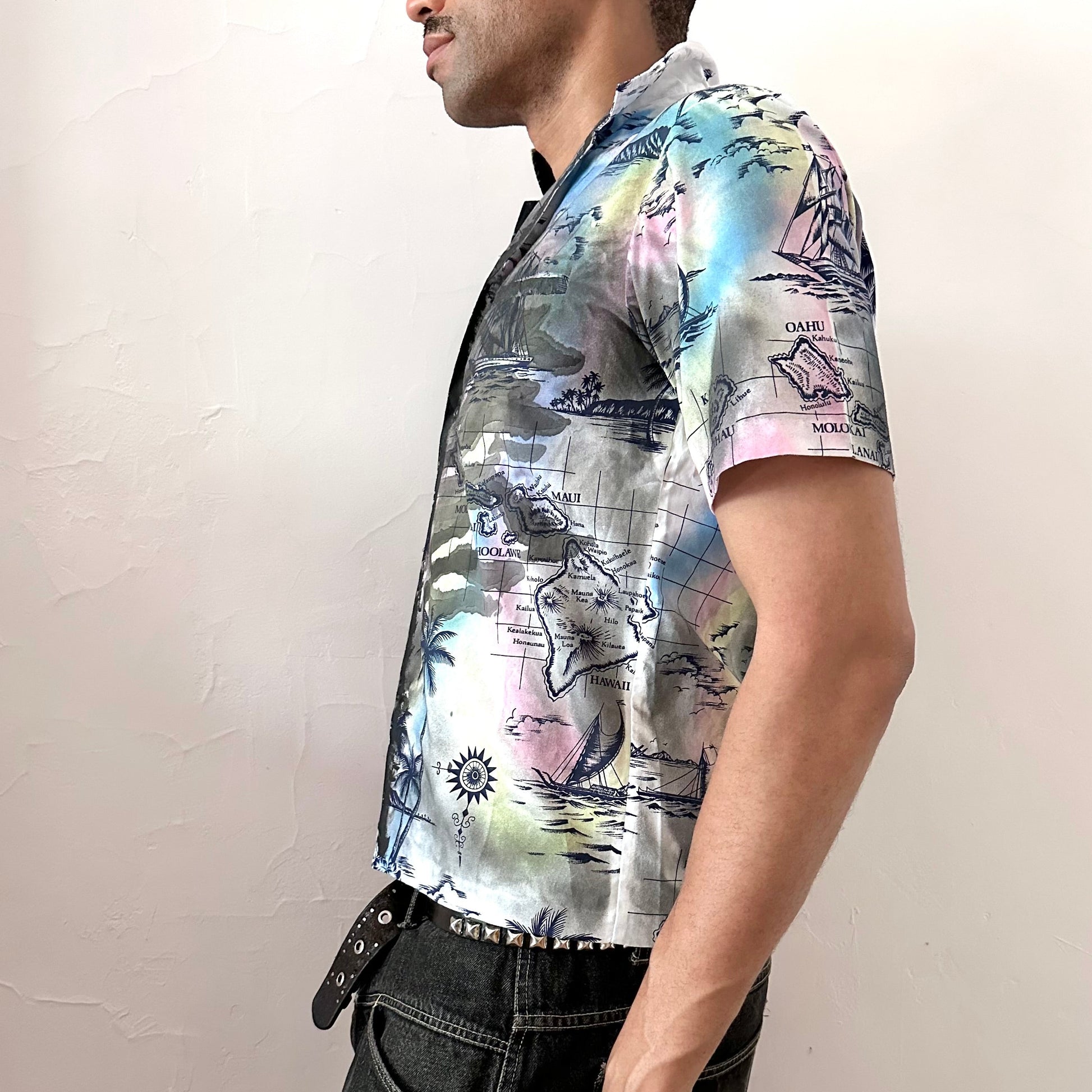 Left side detail of ASTROBOI* 'Sulfur Surfer' showing custom navy Hawaiian paint treatment and iconography detailing on white tropical shirt.