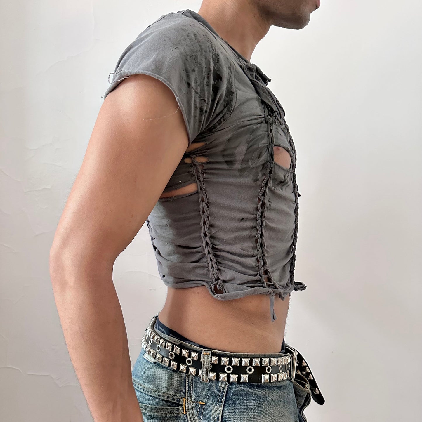 Right side detail of ASTROBOI* 'Waverly' showing braided twist and slash construction on form-fitting gray cropped base.