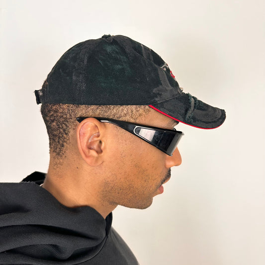 Right side of ASTROBOI* C5M Super Galaxy black baseball cap with resin-sealed rhinestone logo patch and adjustable strap, hand-customized in NYC