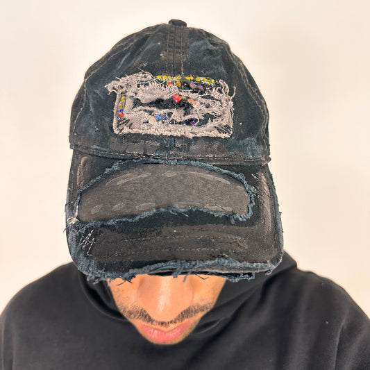 Cover image of ASTROBOI* New York Aquarium navy distressed baseball hat with resin-sealed rhinestone logo, black waxed paint details, adjustable strap, custom NYC piece