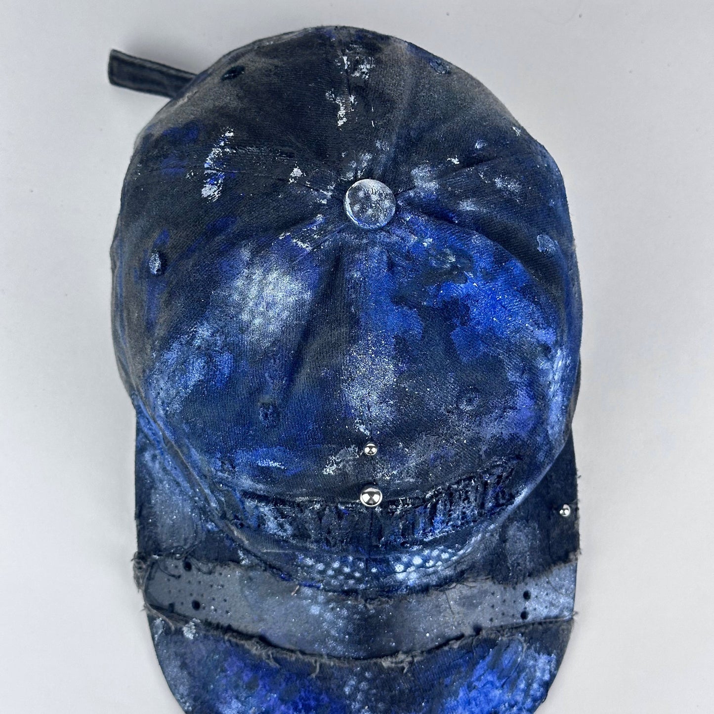 Top-view of ASTROBOI* 'North Star' showing "New York" embroidery detail and black, white, and blue distressed paint design.