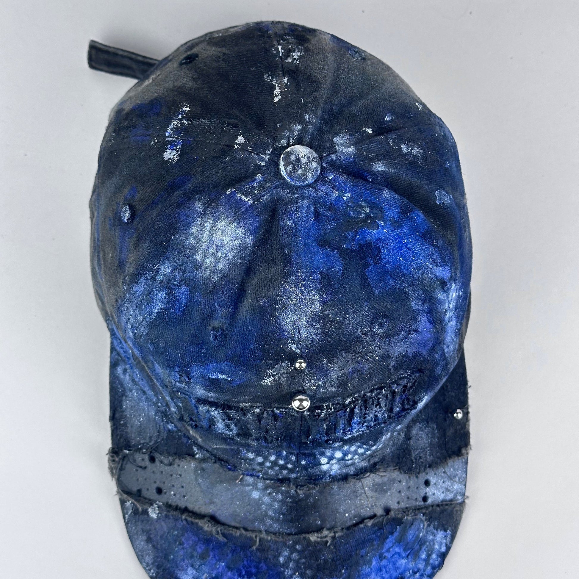 Top-view of ASTROBOI* 'North Star' showing "New York" embroidery detail and black, white, and blue distressed paint design.