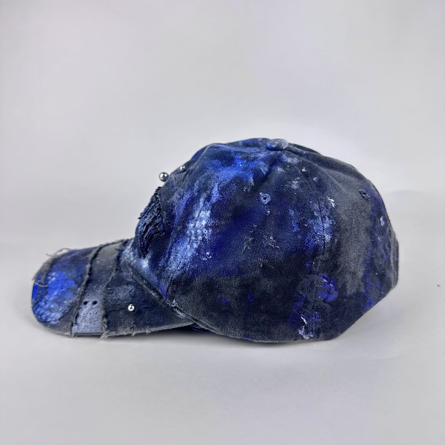 Left side detail of ASTROBOI* 'North Star' showing distressed paint design and piercing detail on visor.