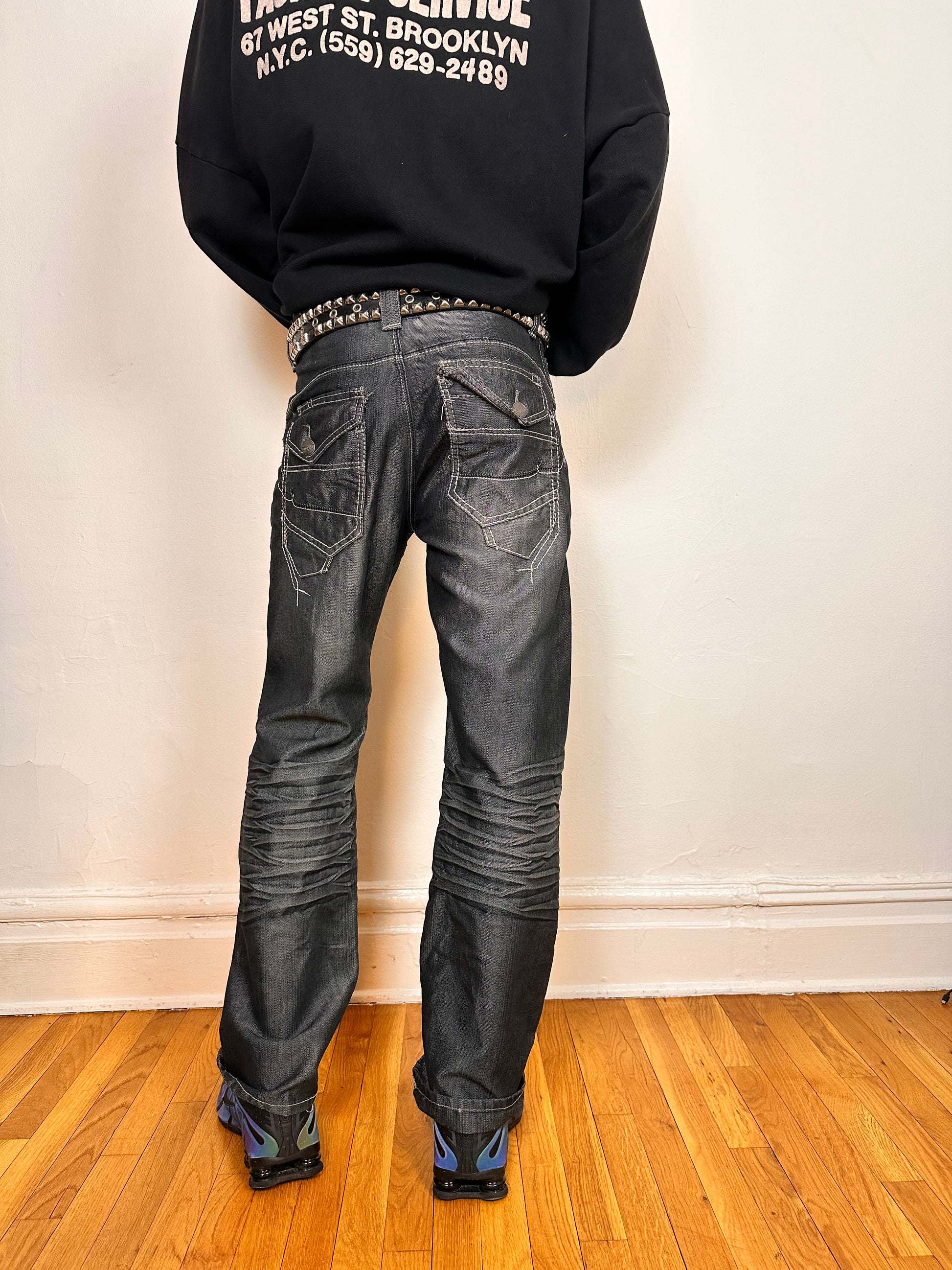 Back side of Vintage Y2K Champs silver and black chambray jeans, relaxed fit with whiskering and flap back pockets, size 32x34