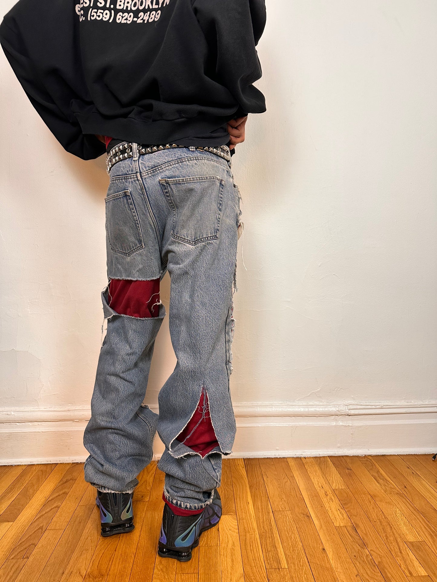 Back side of ASTROBOI* Eddie Bauer mid blue baggy jeans, 38x36, ripped with flannel lining, relaxed fit, customized in NYC