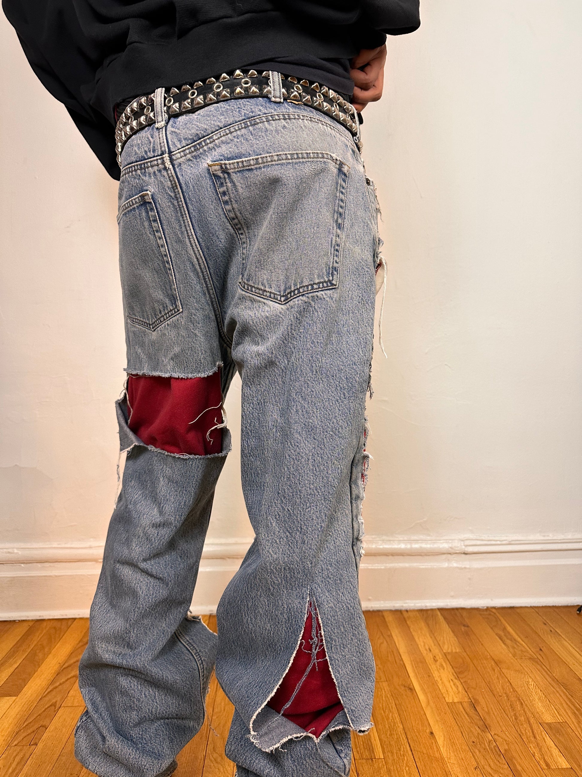 Back close up on ASTROBOI* Eddie Bauer mid blue baggy jeans, 38x36, ripped with flannel lining, relaxed fit, customized in NYC