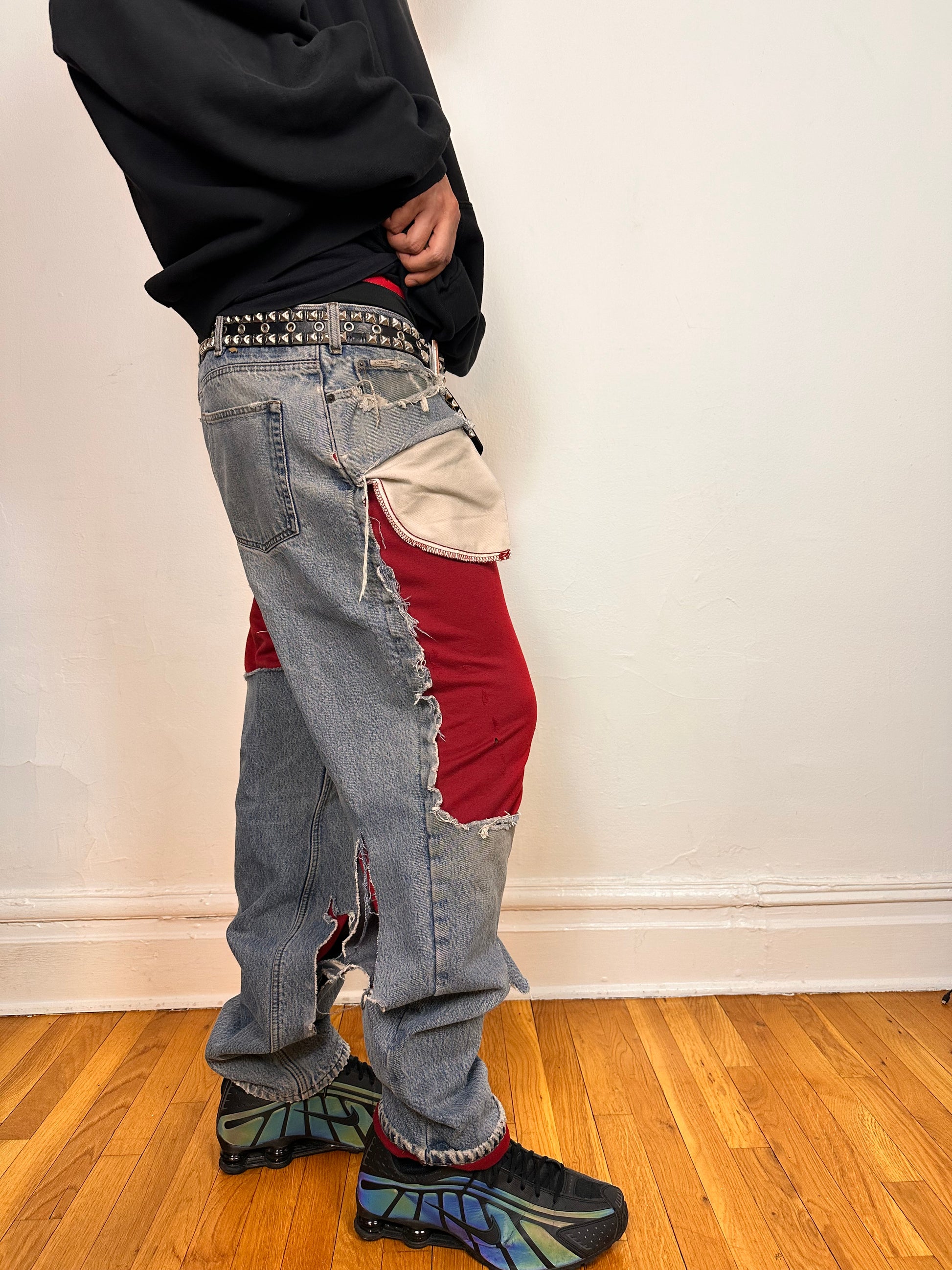 Right side of ASTROBOI* Eddie Bauer mid blue baggy jeans, 38x36, ripped with flannel lining, relaxed fit, customized in NYC