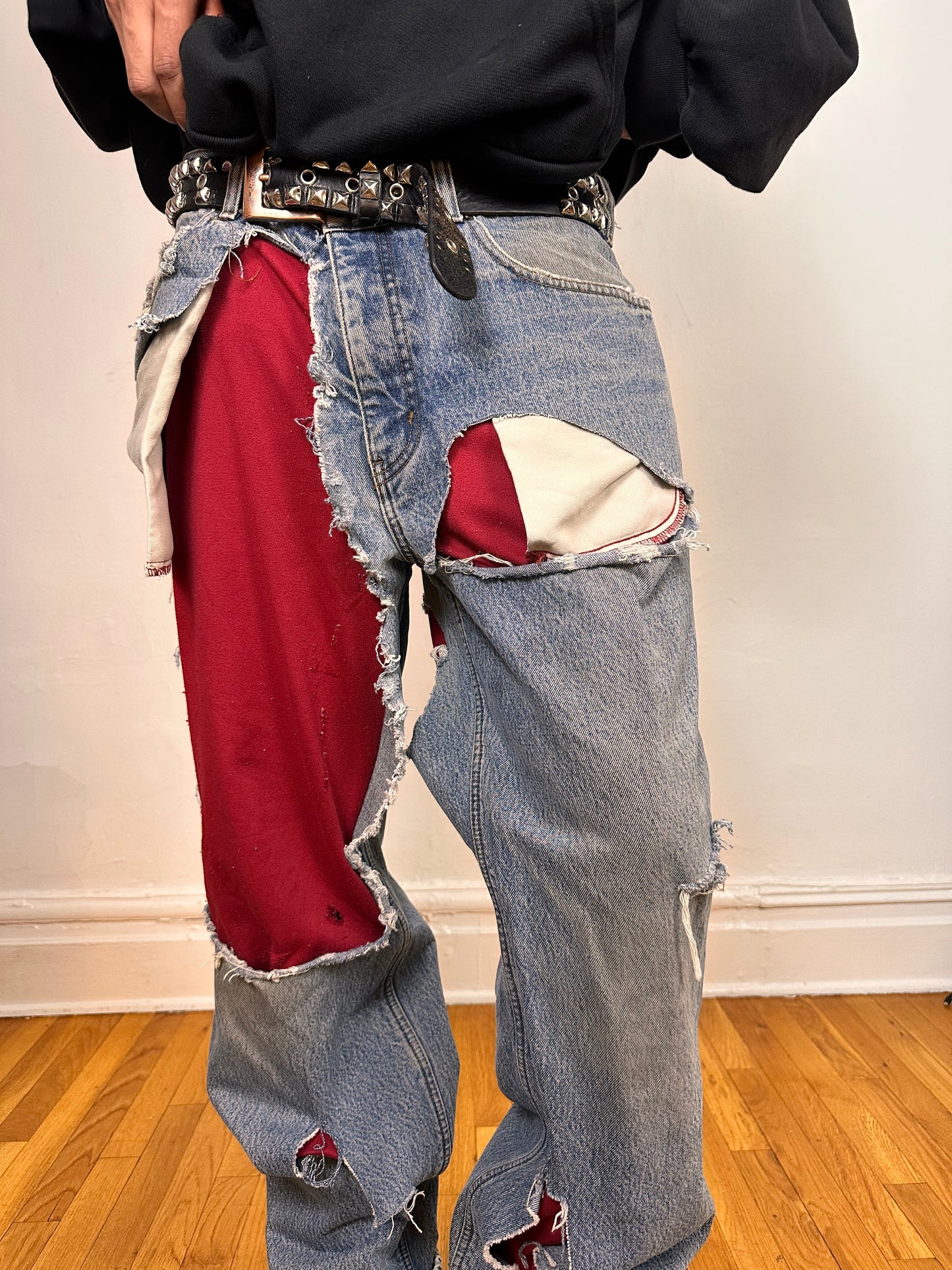 Front close up on ASTROBOI* Eddie Bauer mid blue baggy jeans, 38x36, ripped with flannel lining, relaxed fit, customized in NYC