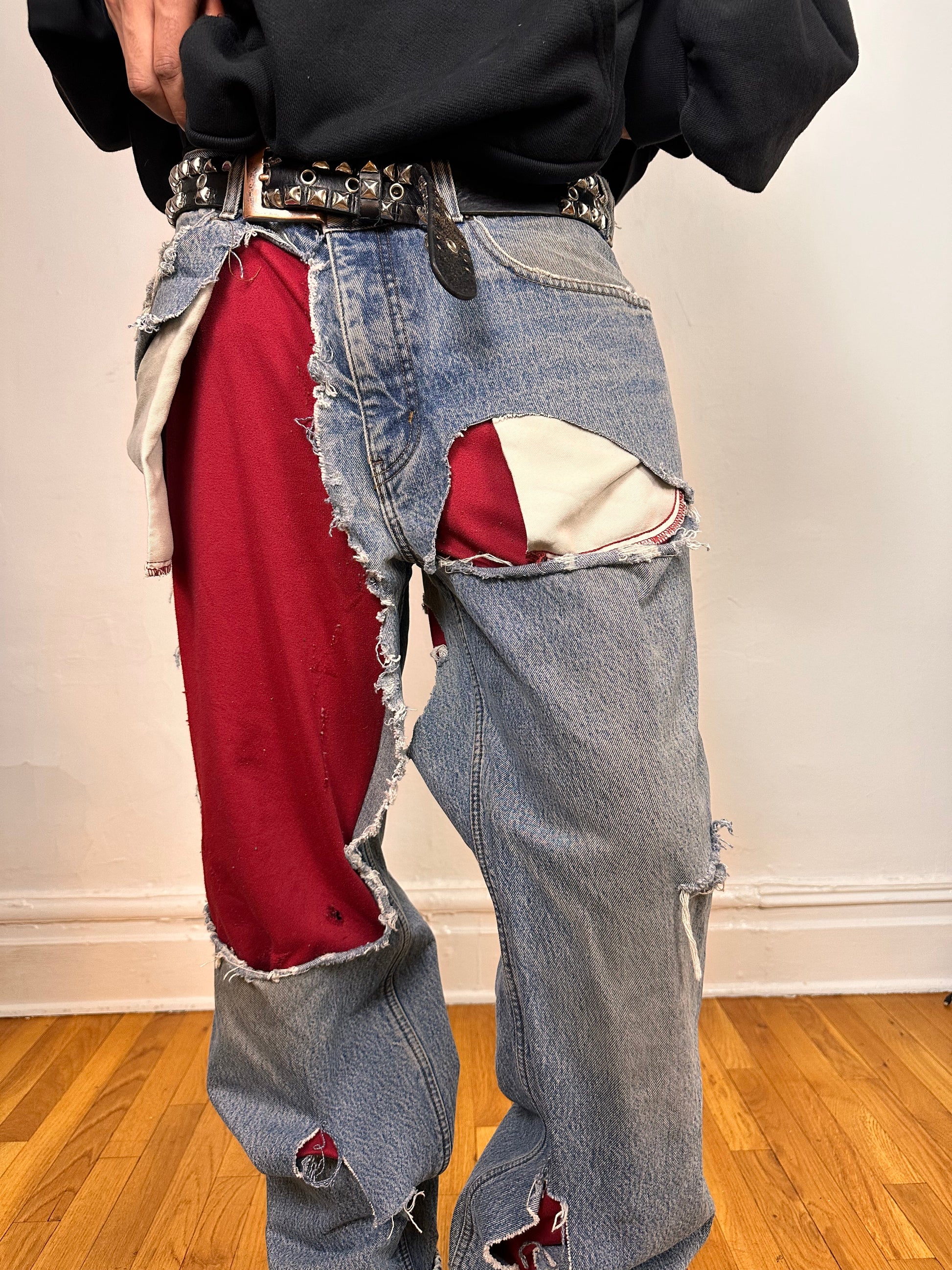 Front close up on ASTROBOI* Eddie Bauer mid blue baggy jeans, 38x36, ripped with flannel lining, relaxed fit, customized in NYC