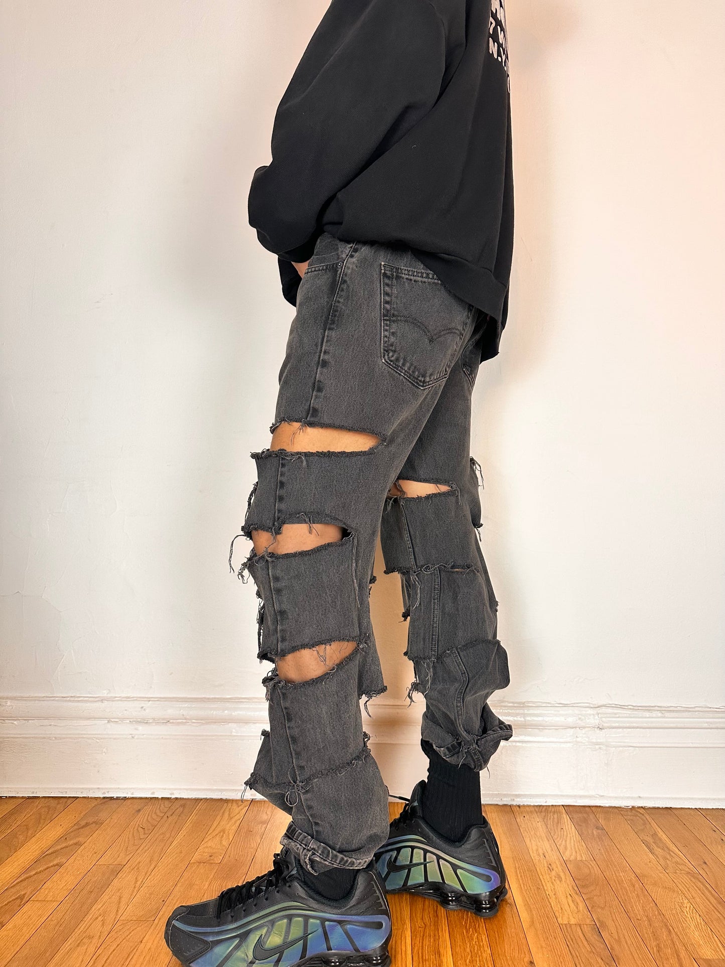 Left side of ASTROBOI* x Levi’s gray ripped jeans with side slashes and straight leg fit, size 36x32, custom distressed in Brooklyn