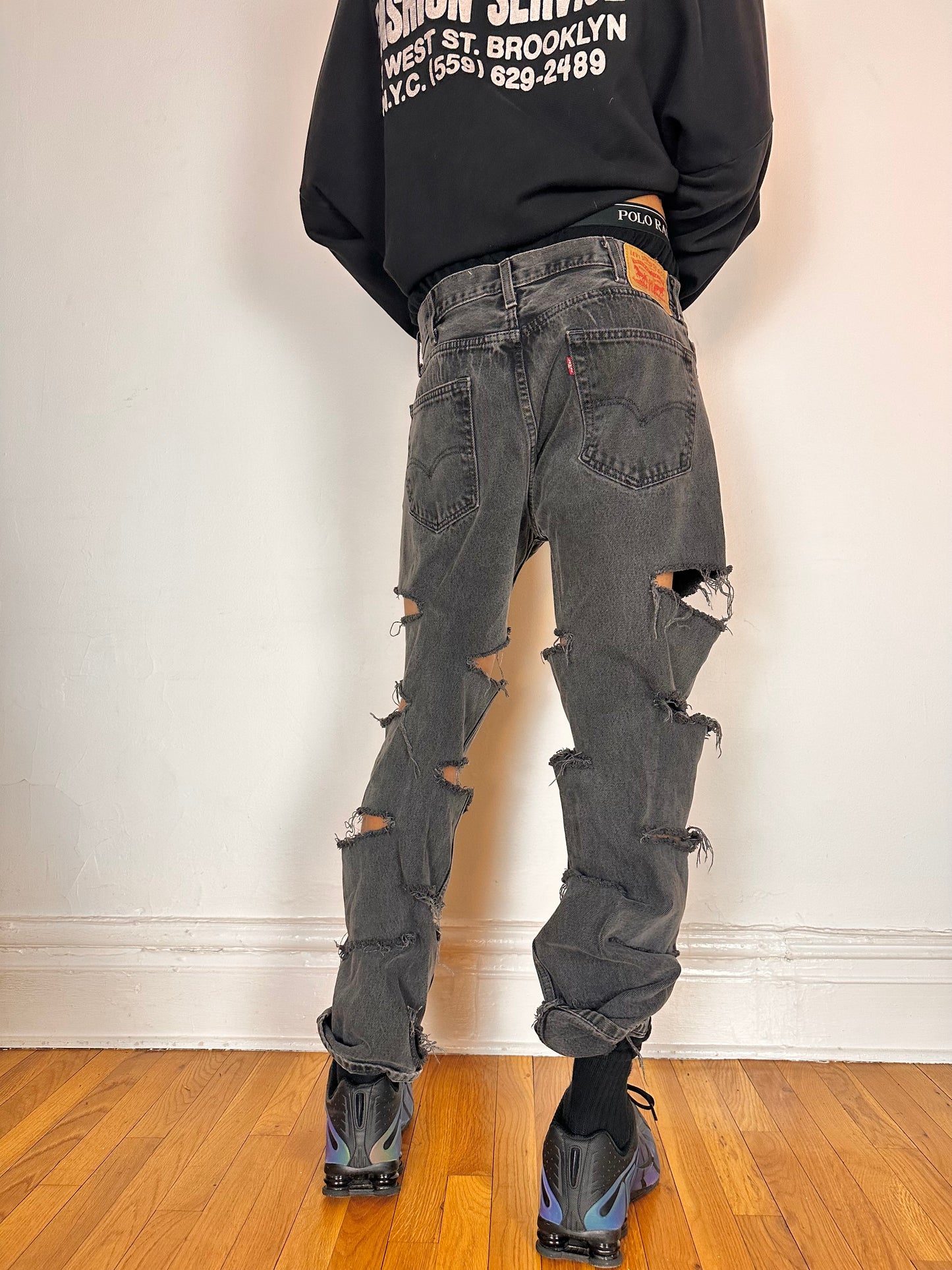 Back side of ASTROBOI* x Levi’s gray ripped jeans with side slashes and straight leg fit, size 36x32, custom distressed in Brooklyn