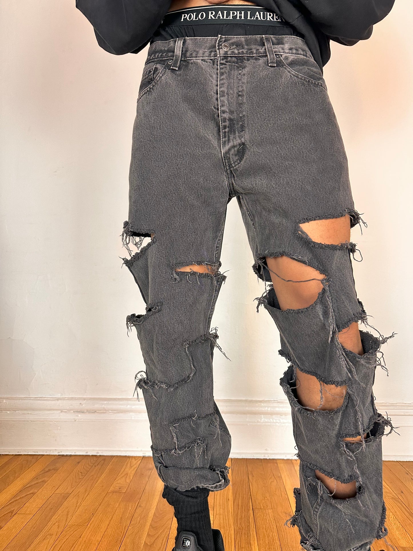 Close up of ASTROBOI* x Levi’s gray ripped jeans with side slashes and straight leg fit, size 36x32, custom distressed in Brooklyn