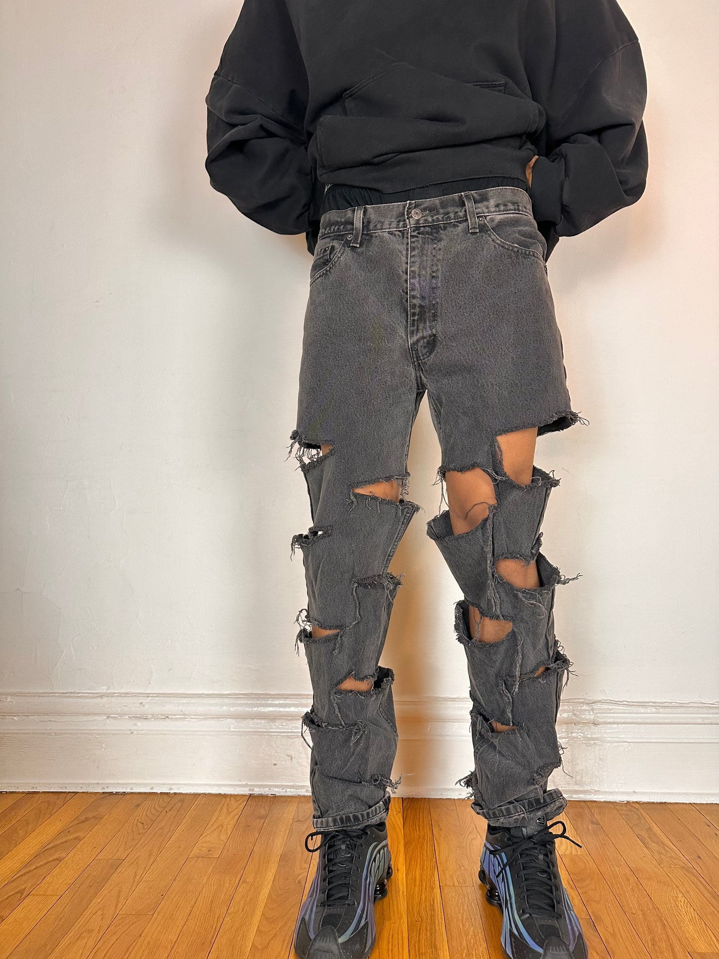 Frontal image of ASTROBOI* x Levi’s gray ripped jeans with side slashes and straight leg fit, size 36x32, custom distressed in Brooklyn