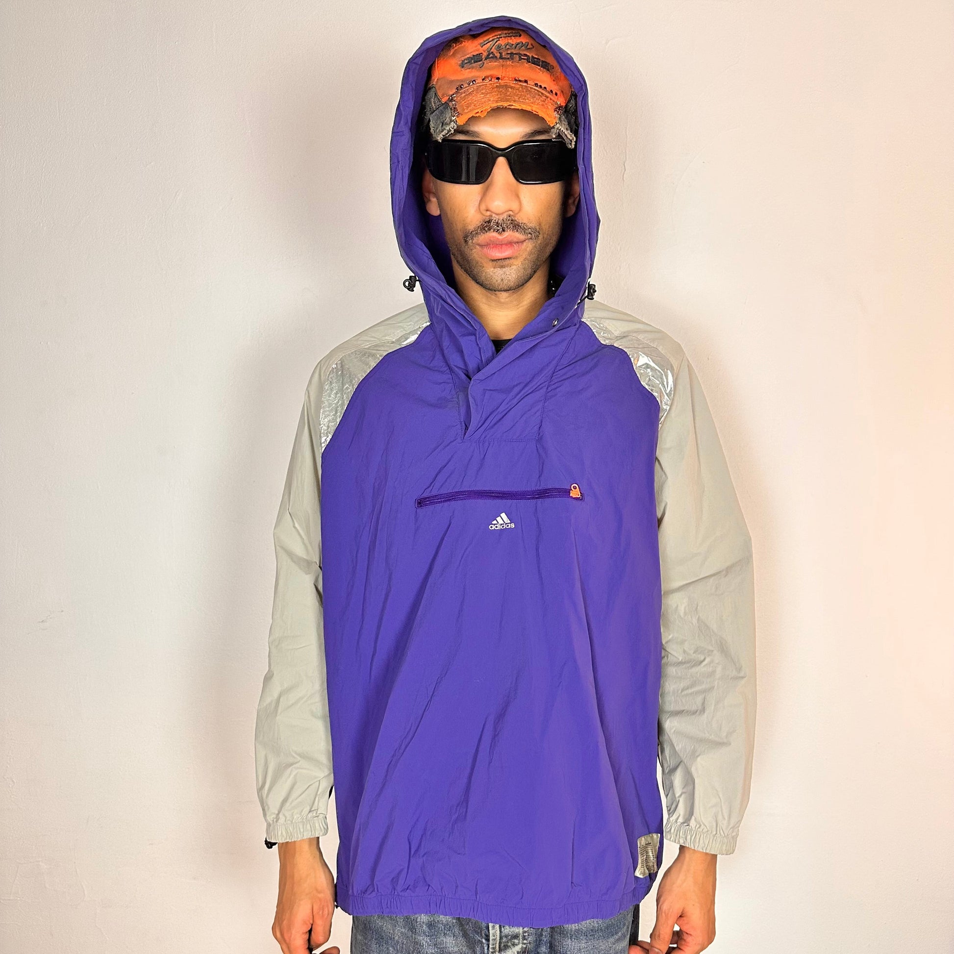Cover image of ADIDAS x KOLOR purple and silver futuristic anorak windbreaker jacket with foil shoulder detailing, mesh ventilation panel, and boxy fit