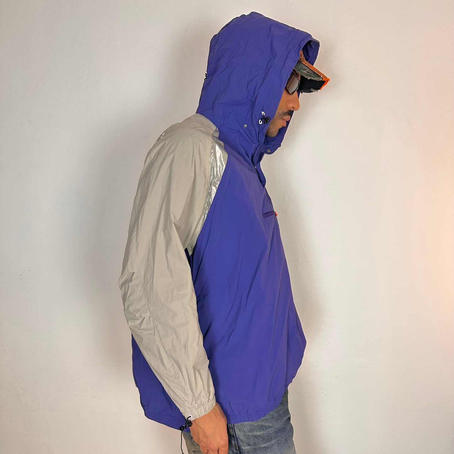 Right side of ADIDAS x KOLOR purple and silver futuristic anorak windbreaker jacket with foil shoulder detailing, mesh ventilation panel, and boxy fit