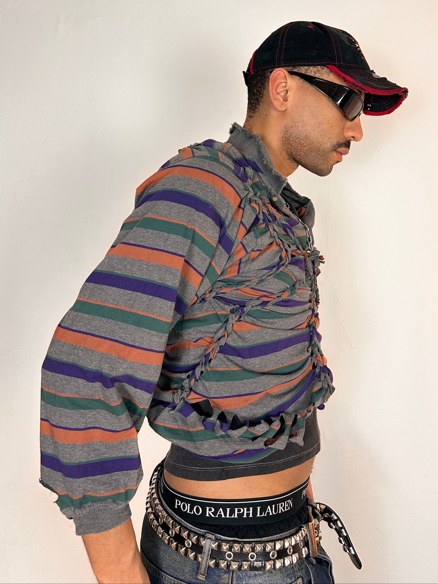 Right side of ASTROBOI* Oren grey striped braided twist long sleeve polo top with deconstructed sleeves and loose fit, size Medium