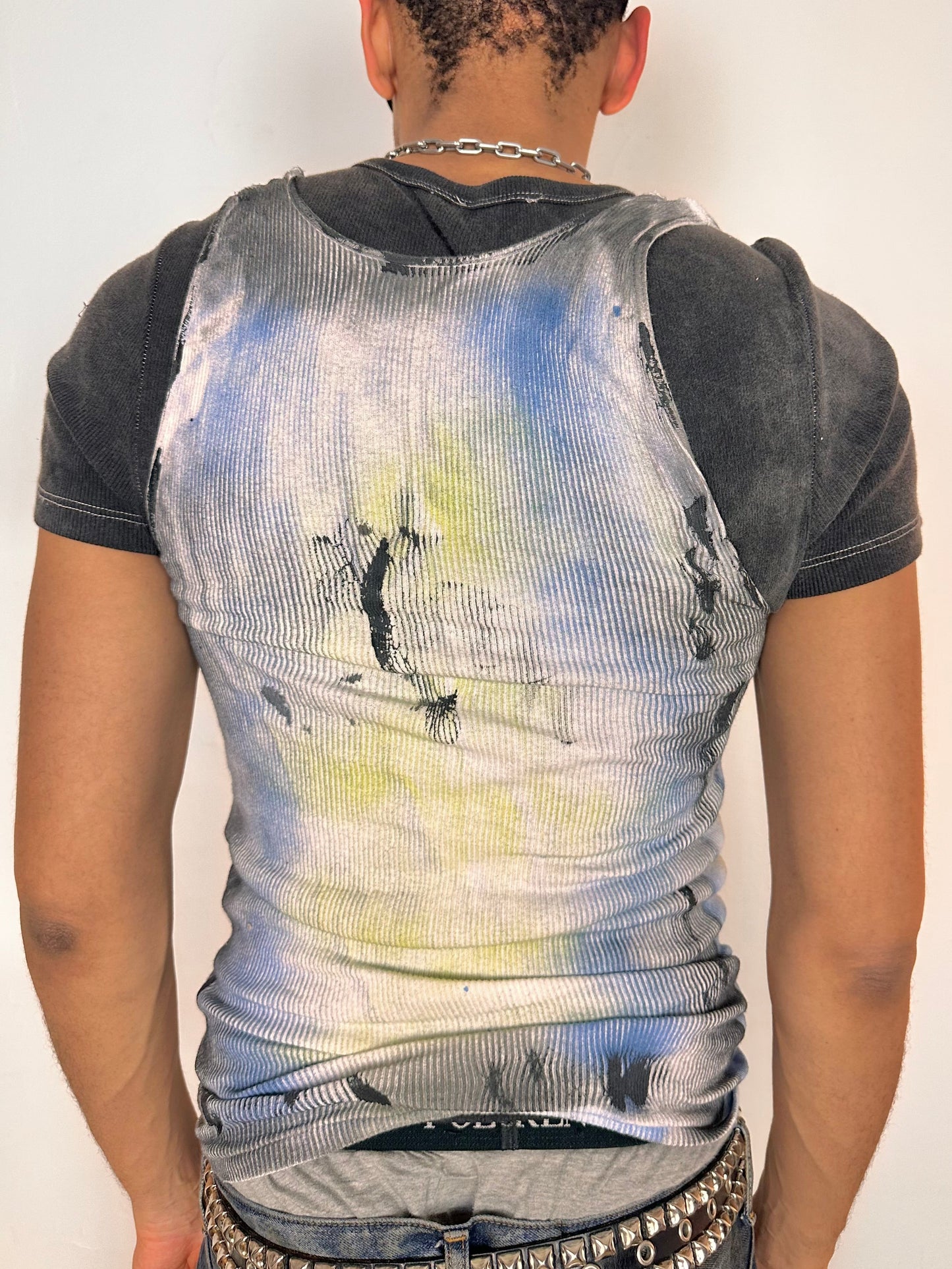 Back of ASTROBOI* x Hanes white tank top with black Y2K tattoo print and blue yellow airbrushed details, size Large, slim fit, made in NYC