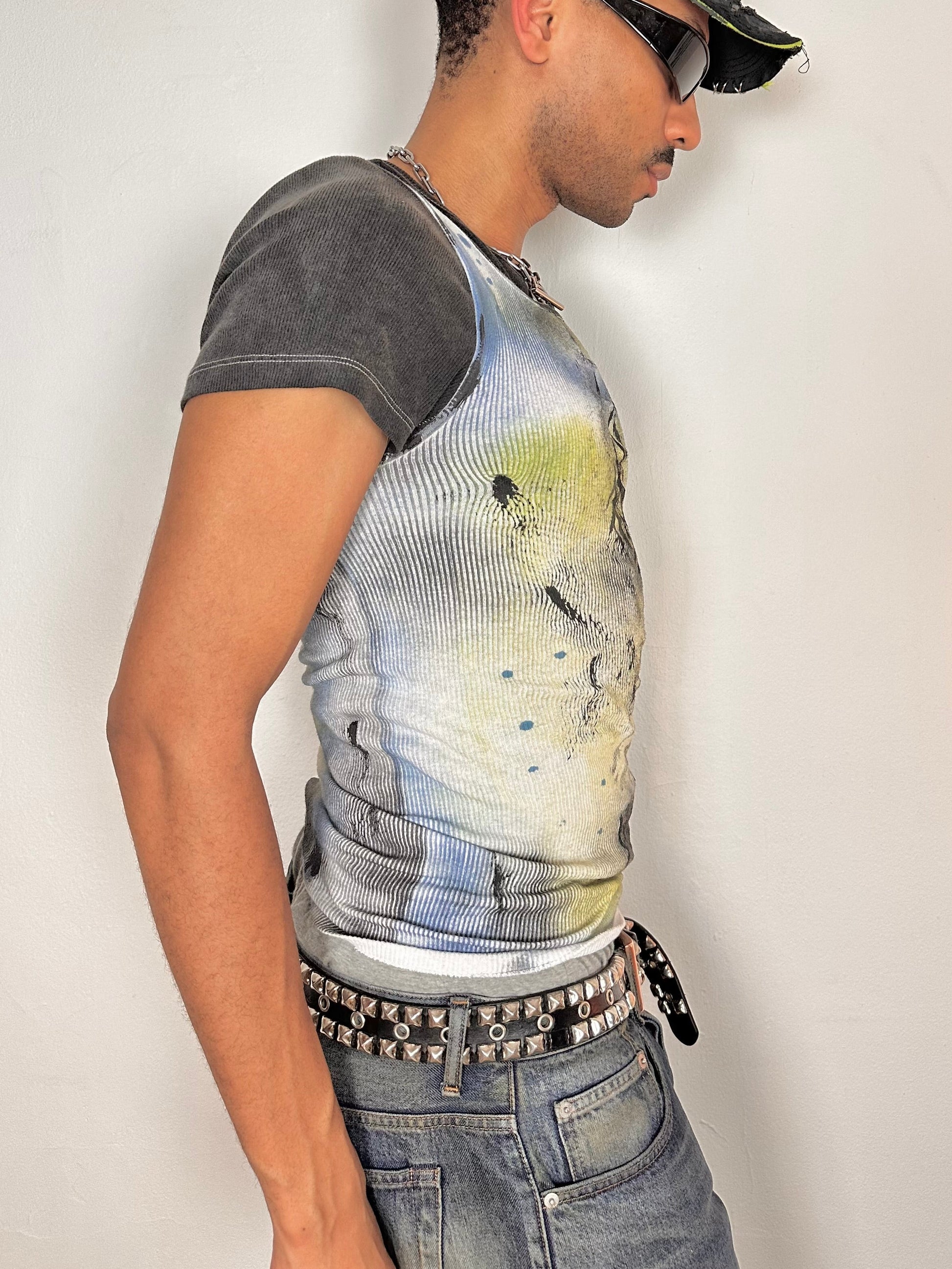 Right side of ASTROBOI* x Hanes white tank top with black Y2K tattoo print and blue yellow airbrushed details, size Large, slim fit, made in NYC