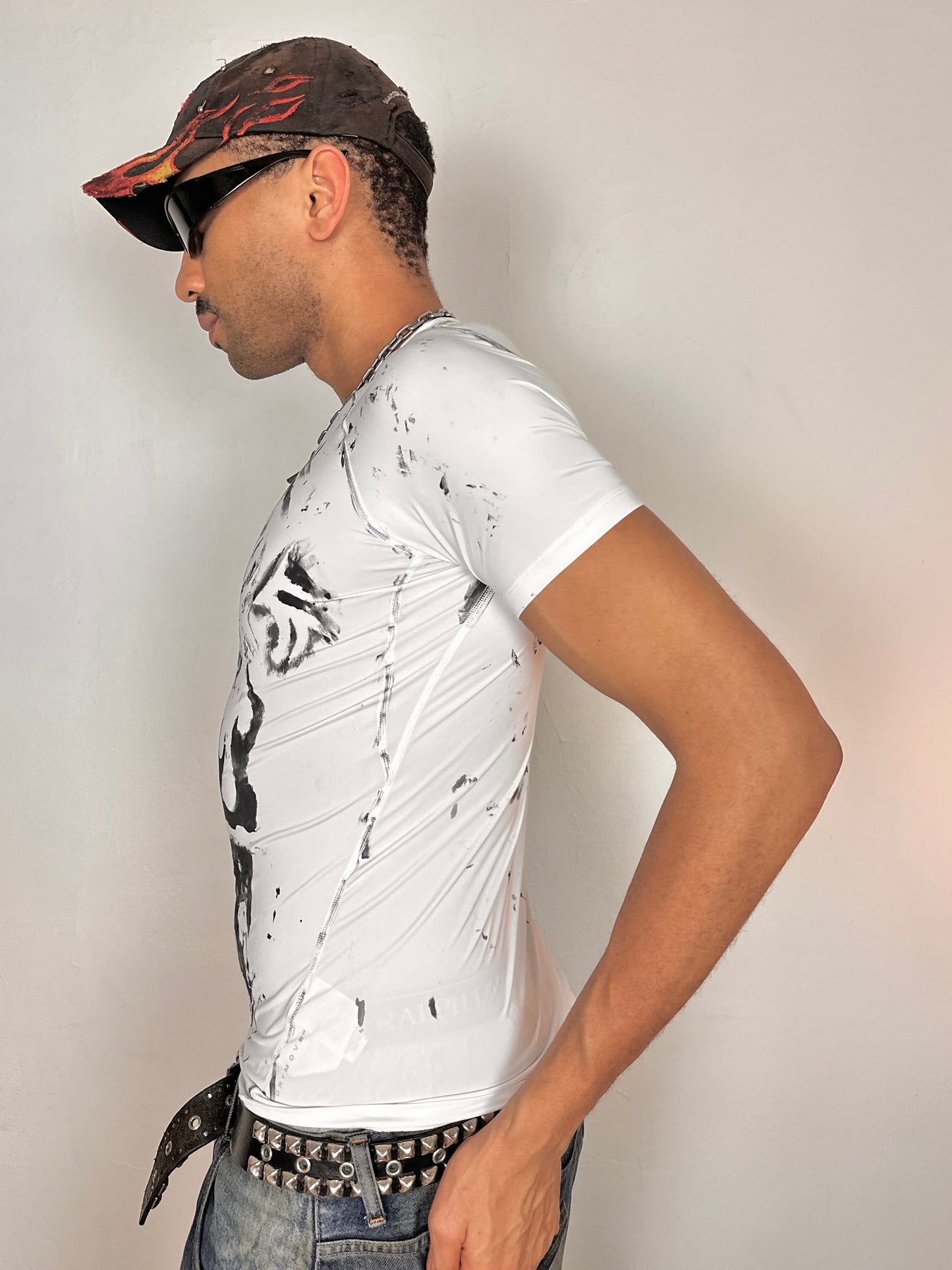 Left side of ASTROBOI* Flames white and black tattoo print compression top with stretch fabric and tight fit, hand-painted design, size Medium
