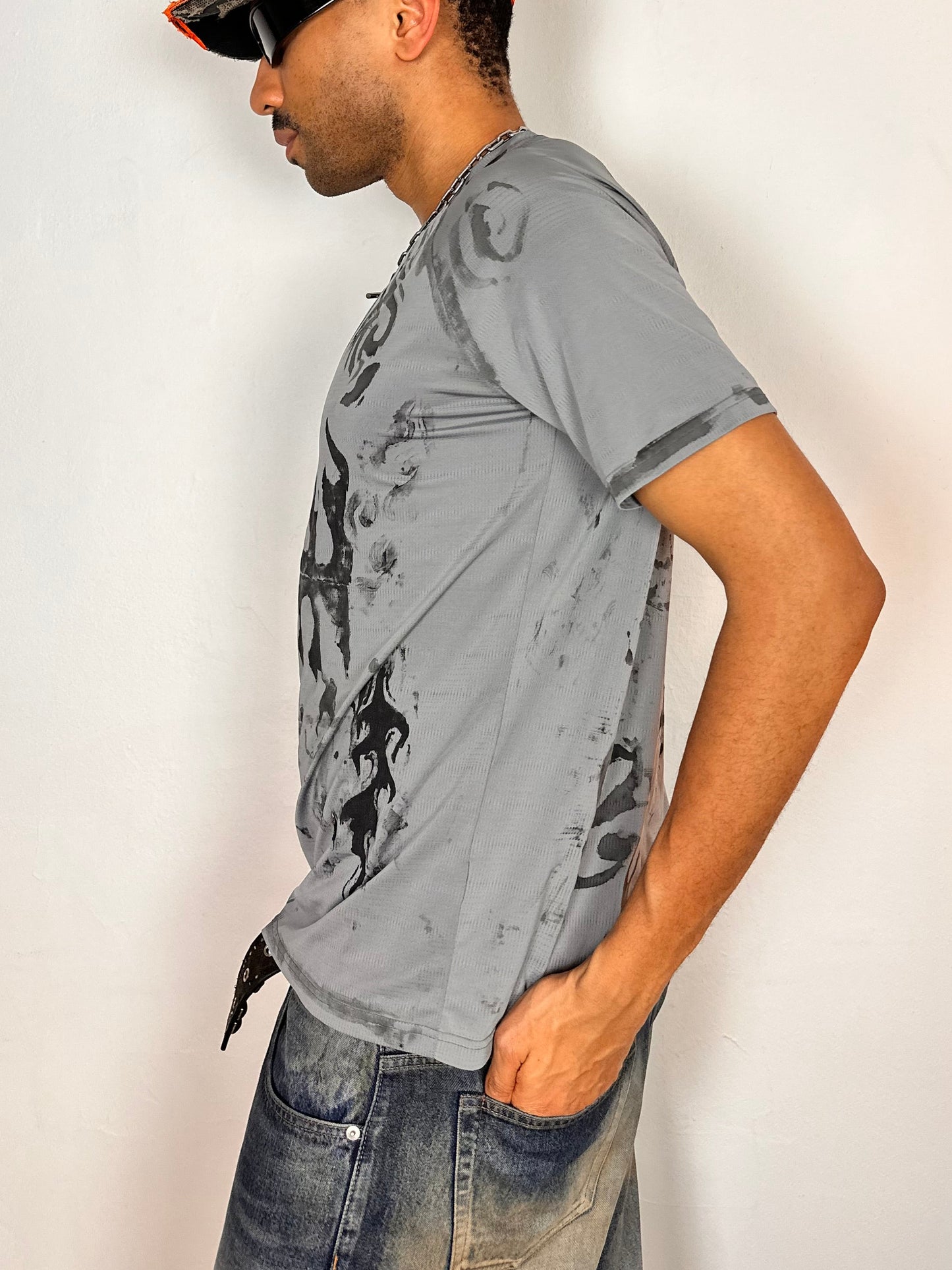 Left side of ASTROBOI* Flames grey and black tattoo print compression top with moisture-wicking sports fabric and tight fit, size Large