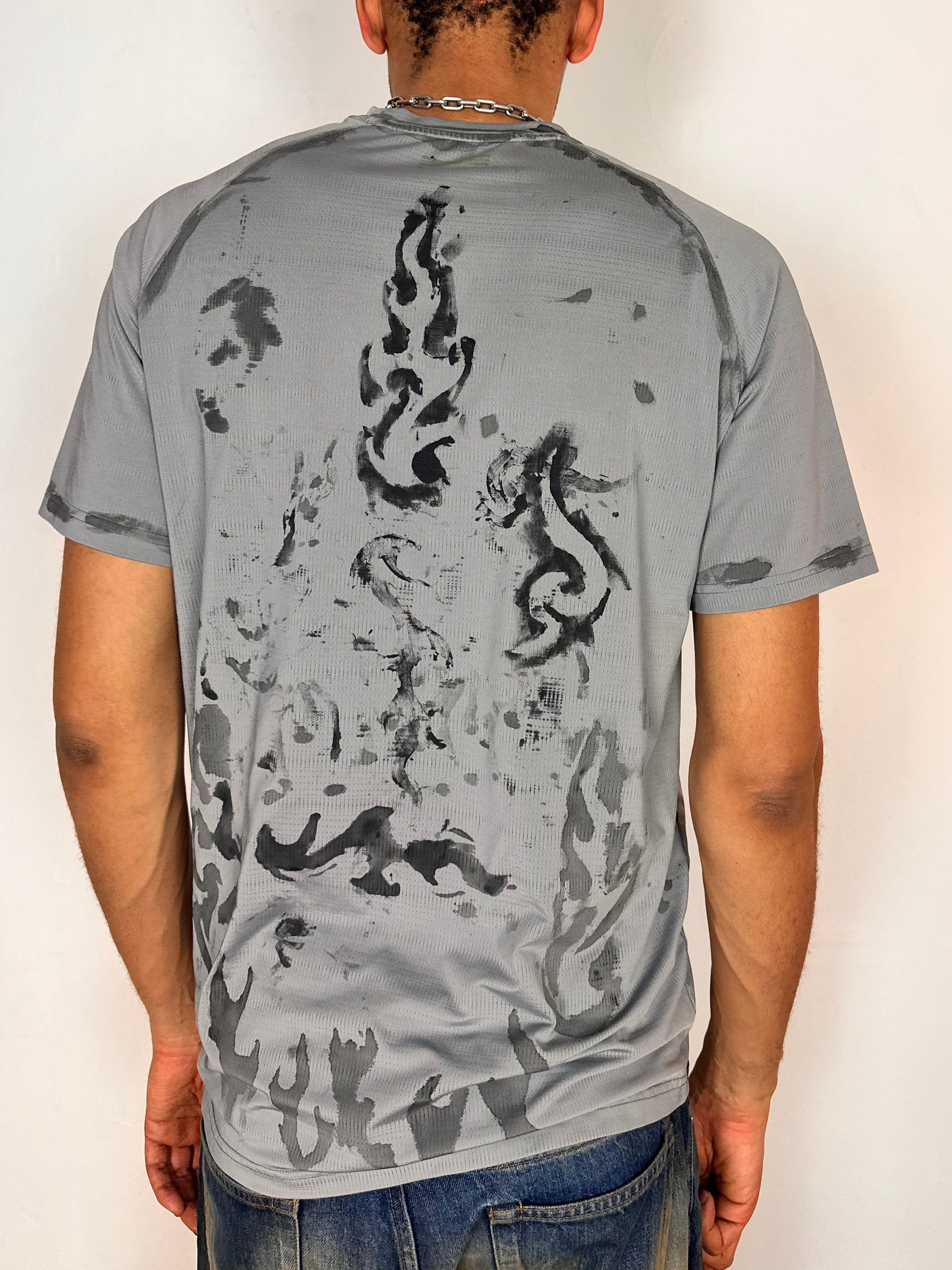 Back of ASTROBOI* Flames grey and black tattoo print compression top with moisture-wicking sports fabric and tight fit, size Large