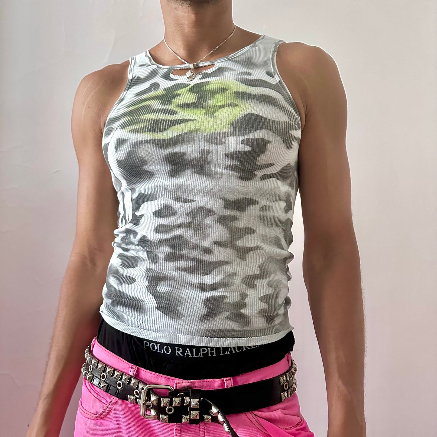 ASTROBOI* x Hanes 'Bliss' white tank top with black abstract camouflage print and lime green orb at center chest, opening at front collar, front view.