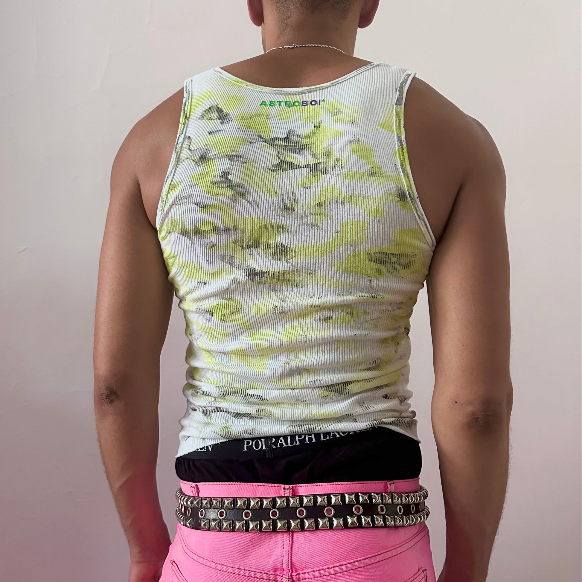ASTROBOI* x Hanes 'Bliss' white camouflage print tank top, rear view showing mismatched back print and ASTROBOI* branded logo beneath collar, worn by male model.
