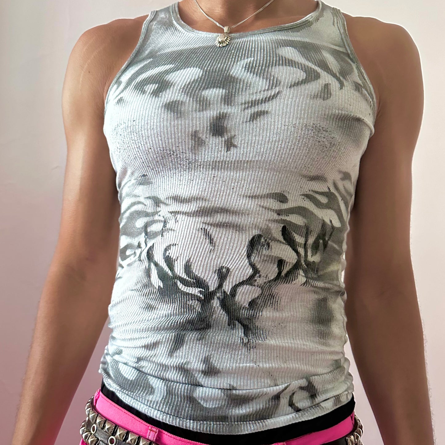 Close-up of ASTROBOI* x Gildan 'Black Fire' showing black abstract flame print detail on white 100% cotton fabric.