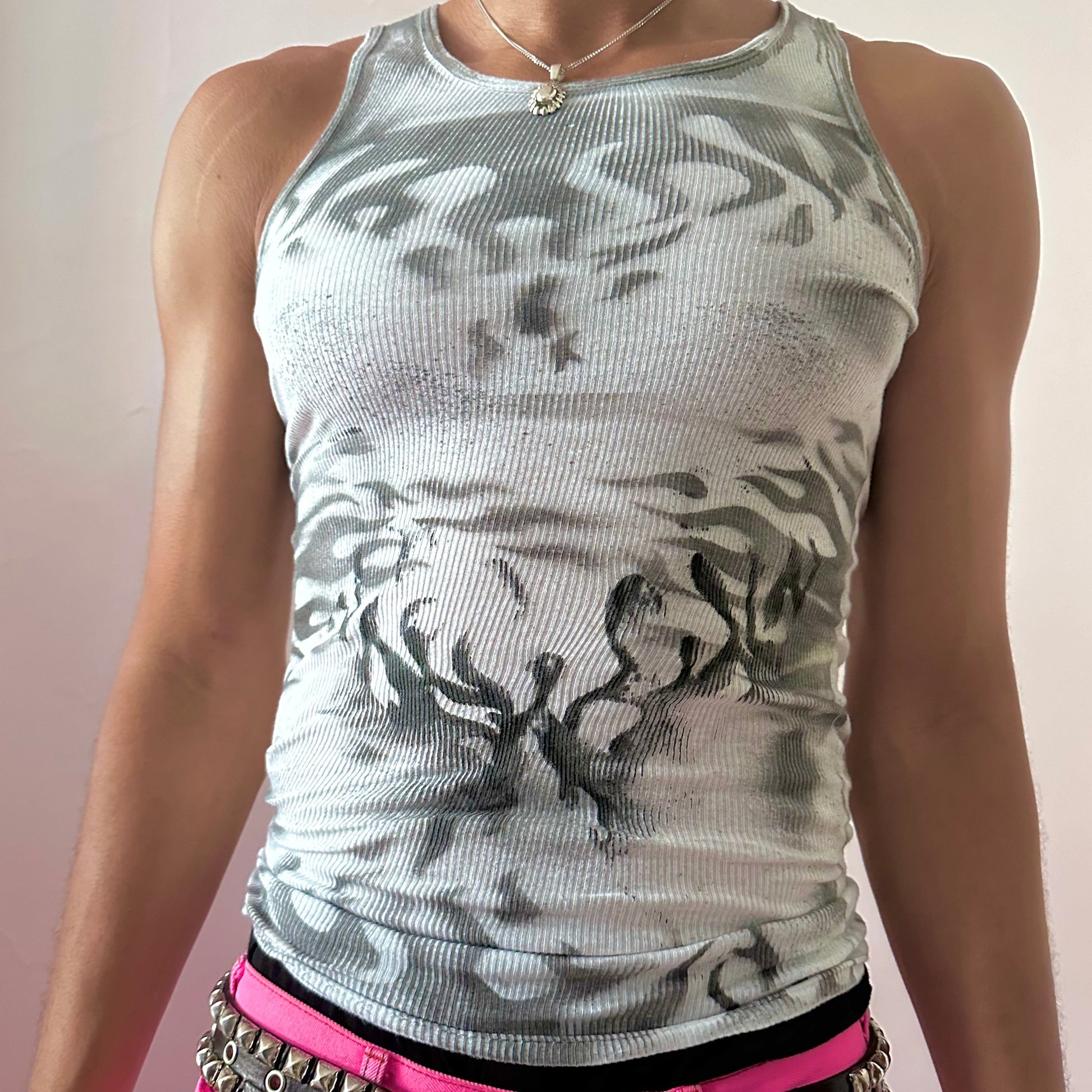 Close-up of ASTROBOI* x Gildan 'Black Fire' showing black abstract flame print detail on white 100% cotton fabric.