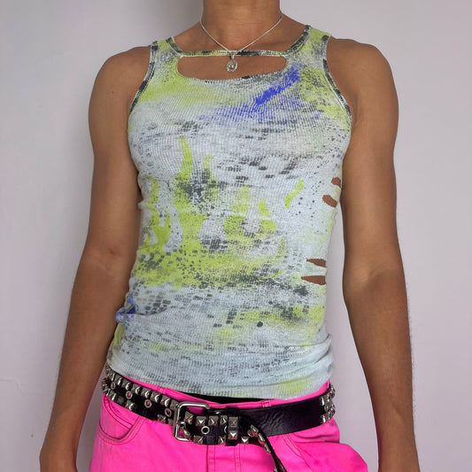 ASTROBOI* x Gildan 'Blitz' white tank top with hand-painted digital camouflage design, acid green flames, ultraviolet and black splatters, and cut-outs at neckline and sides, front view.